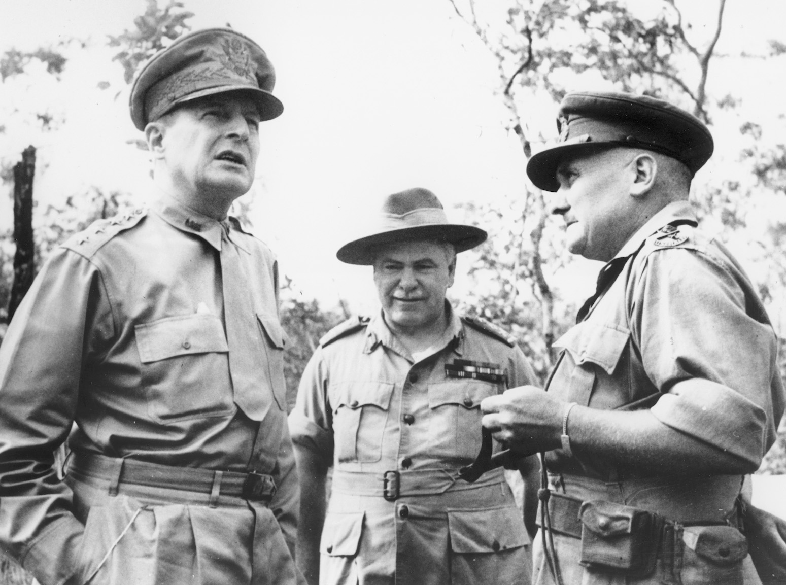 Douglas MacArthur visits the Kokoda Track for the first time, here conferring with General Sir Thomas Blamey and Maj. Gen. G.S. Allen.