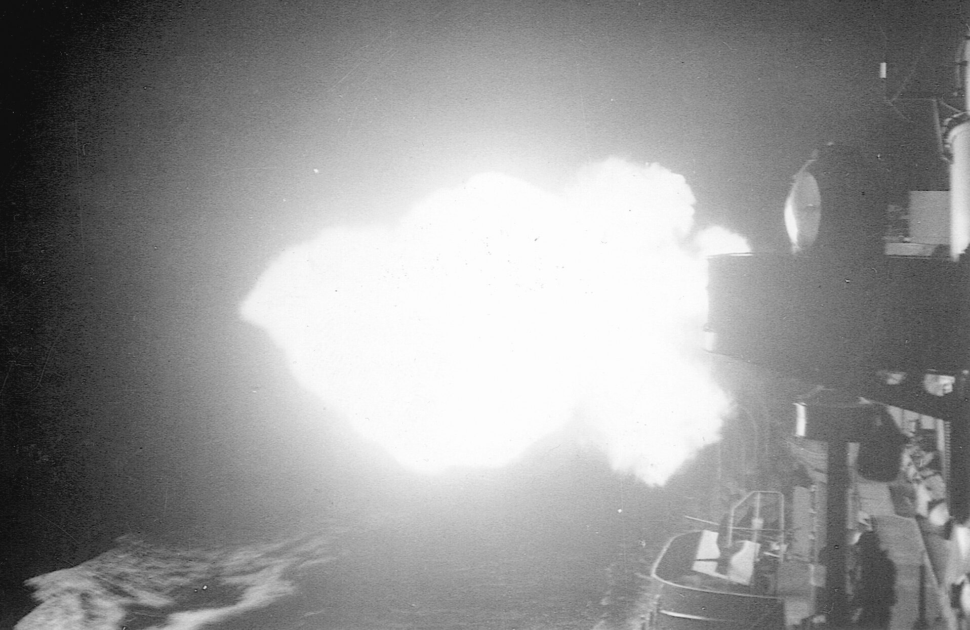 Guns of the USS O’Bannon erupt in smoke and fire during the night action at Kula Gulf.
