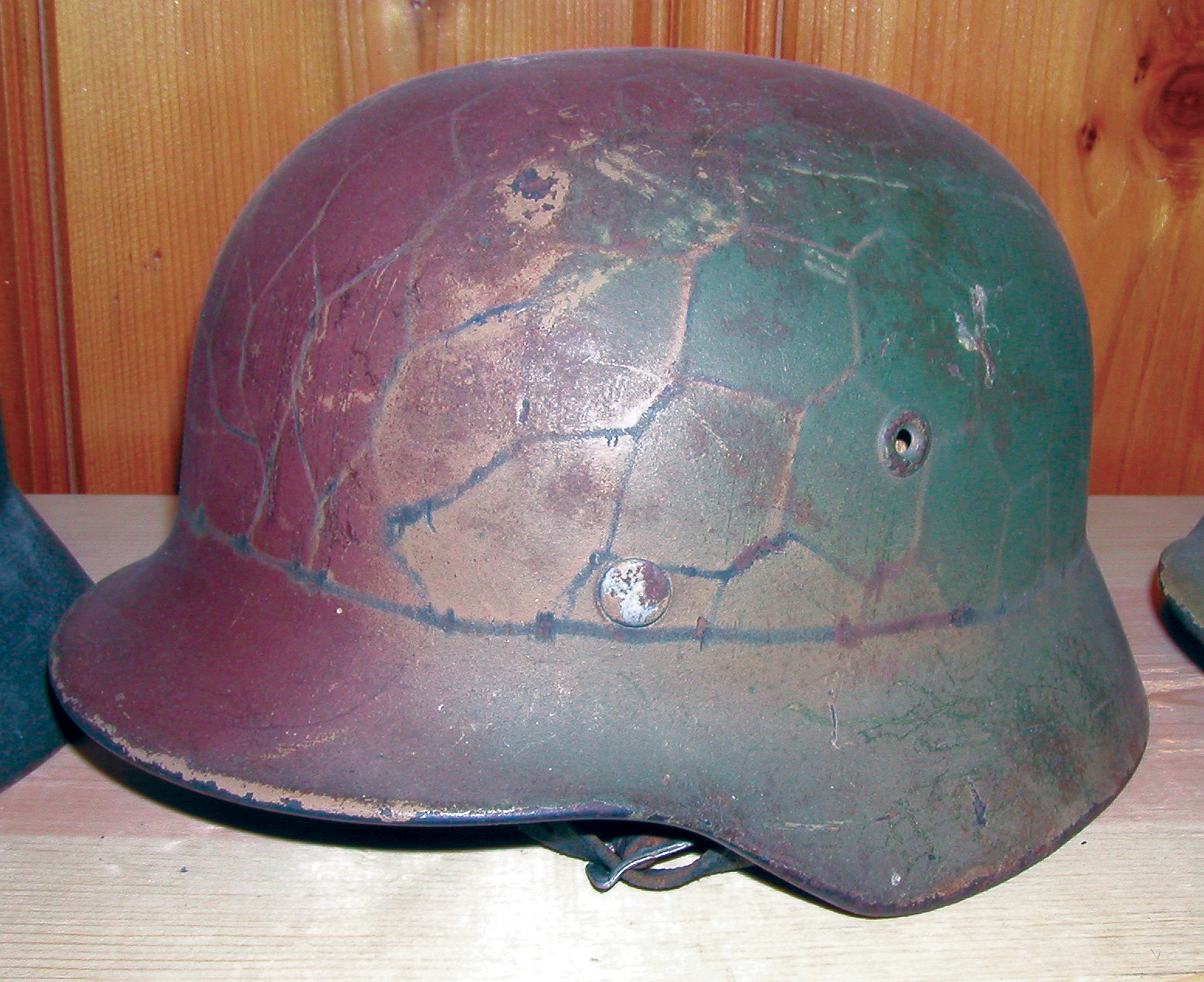 A helmet with some battlefield camouflage.