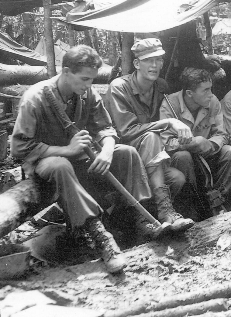 GIs of the 120th Field Artillery in New Guinea in August 1944. One holds a captured Japanese sword, which was a prized “souvenir.”
