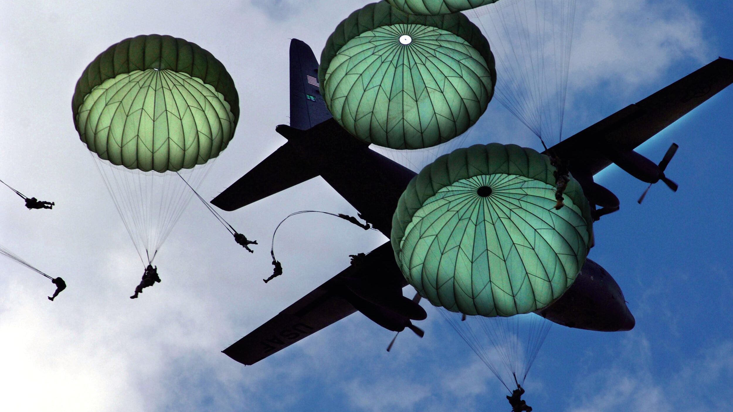 Paratroopers of the U.S. 82nd Airborne Division perform a mass jump during the 2006 Joint Service Open House at Joint Base Andrews in Prince George's County, Maryland. The 82nd was the U.S. Army's first airborne division, converted from an infantry division prior to World War II.
