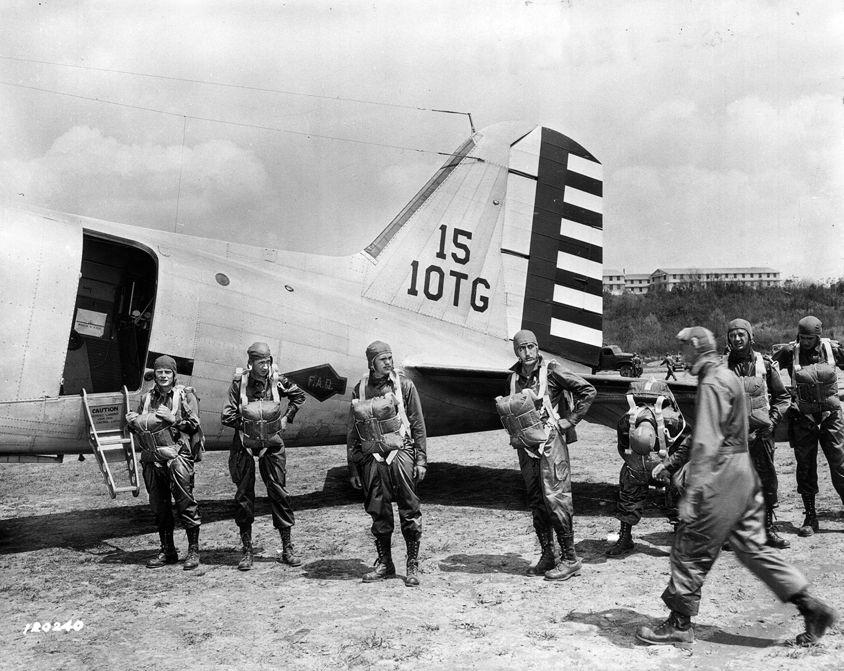 Paratroopers line up to board their transport plane for a practice jump at Lawson Field, near Fort Benning, Georgia. This jump took place in April 1941, eight months before the United States entered World War II.