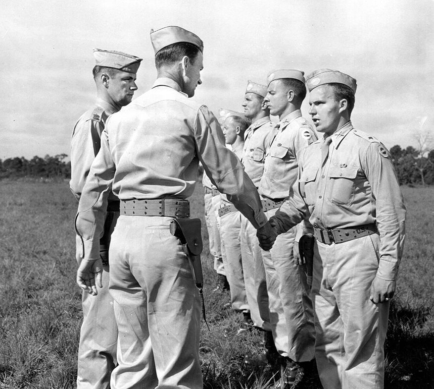 Lt. Col. James M. Gavin congratulates officers of the 505th Parachute Infantry Regiment who have just received their jump wings during ceremonies at Fort Benning, Georgia, in August 1942. Gavin went on to command the 82nd Airborne Division. 