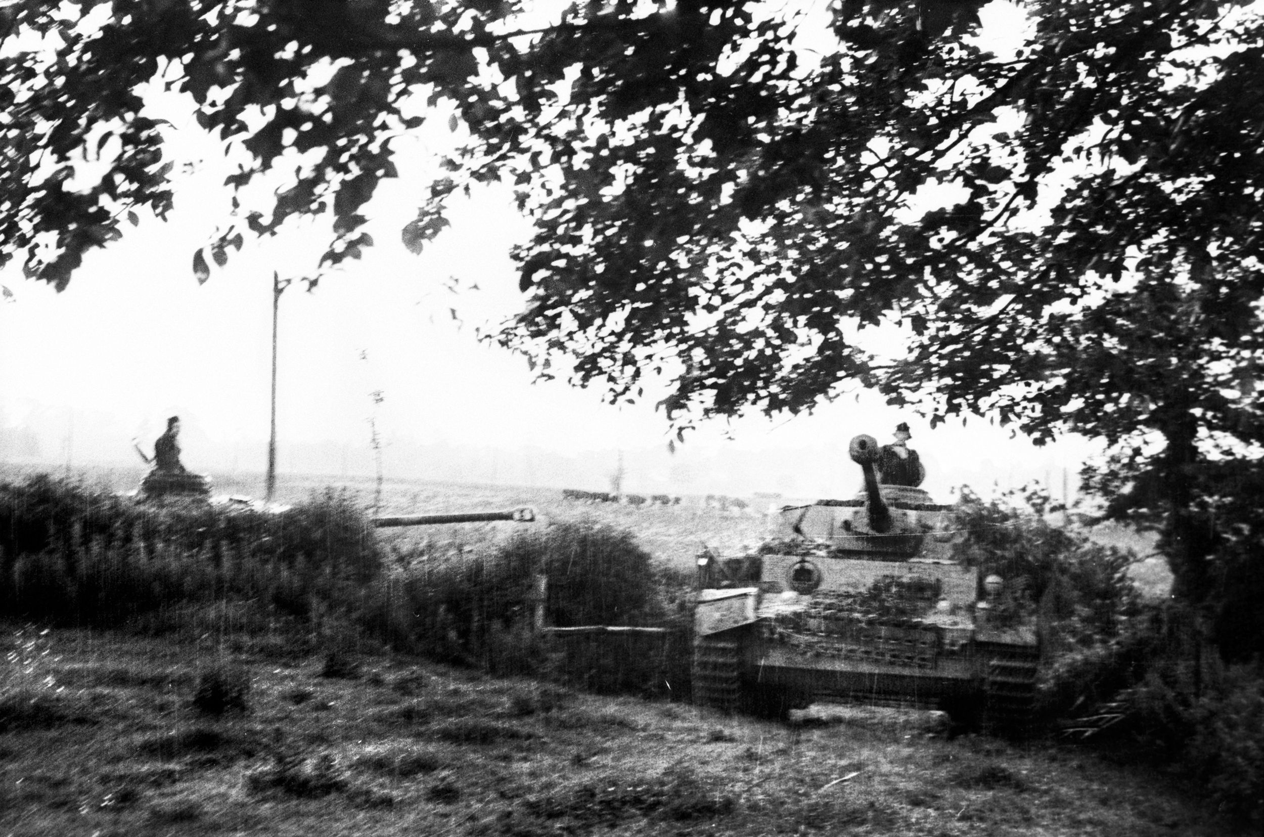 Deployed east of the Orne River in Normandy, tanks of the 21st Panzer Division pause during operations against the Allies in Normandy. Elements of the 21st Panzer reached the French coastline late on D-Day, fought through July, and was almost totally destroyed in the Falaise pocket in August.