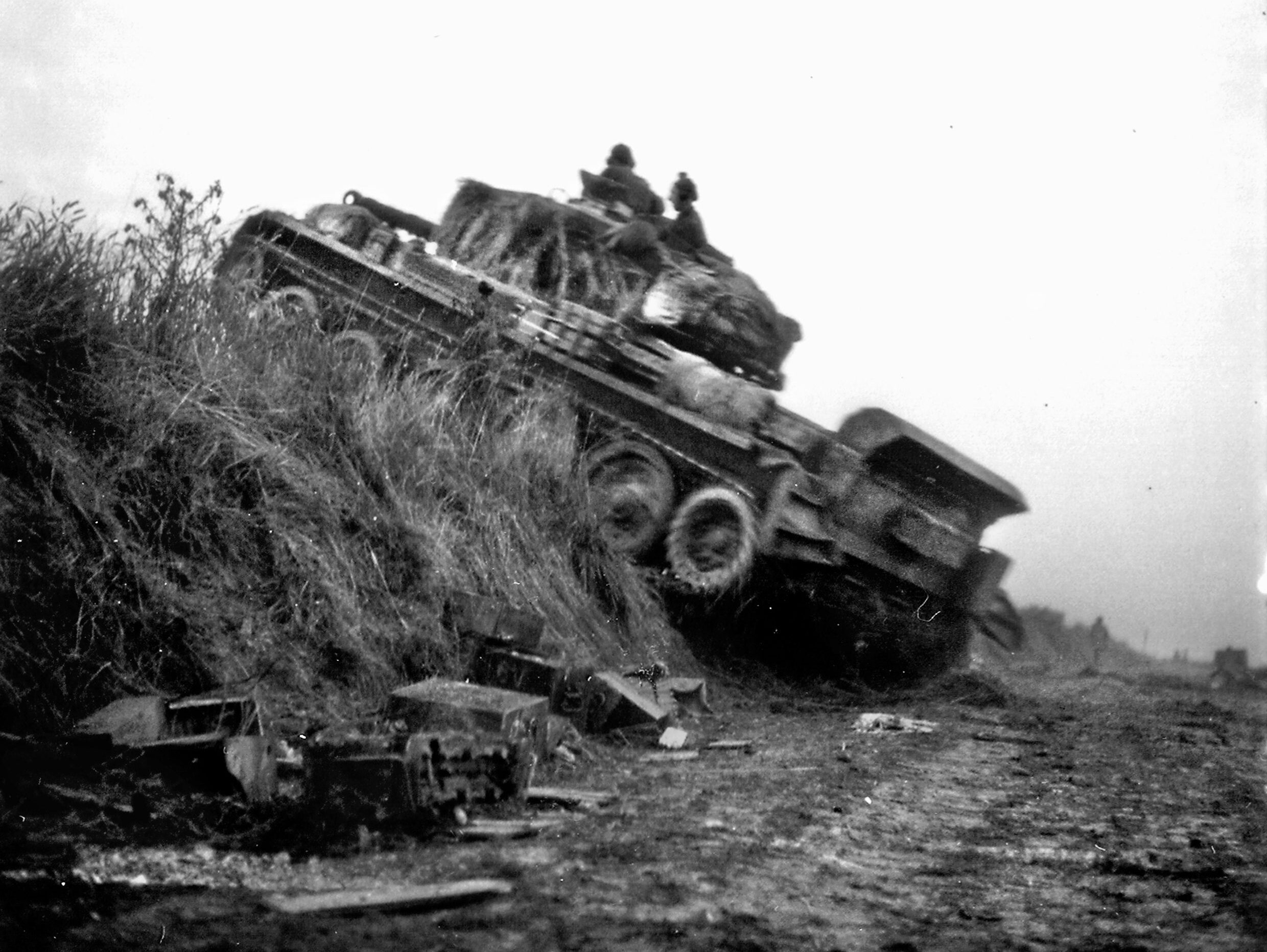 A Cromwell tank of a Canadian armored regiment climbs a hill during the intense fighting in Normandy following D-Day. Canadian troops came ashore at Juno Beach and contributed substantially to the eventual Allied breakout and defeat of the enemy around Falaise.