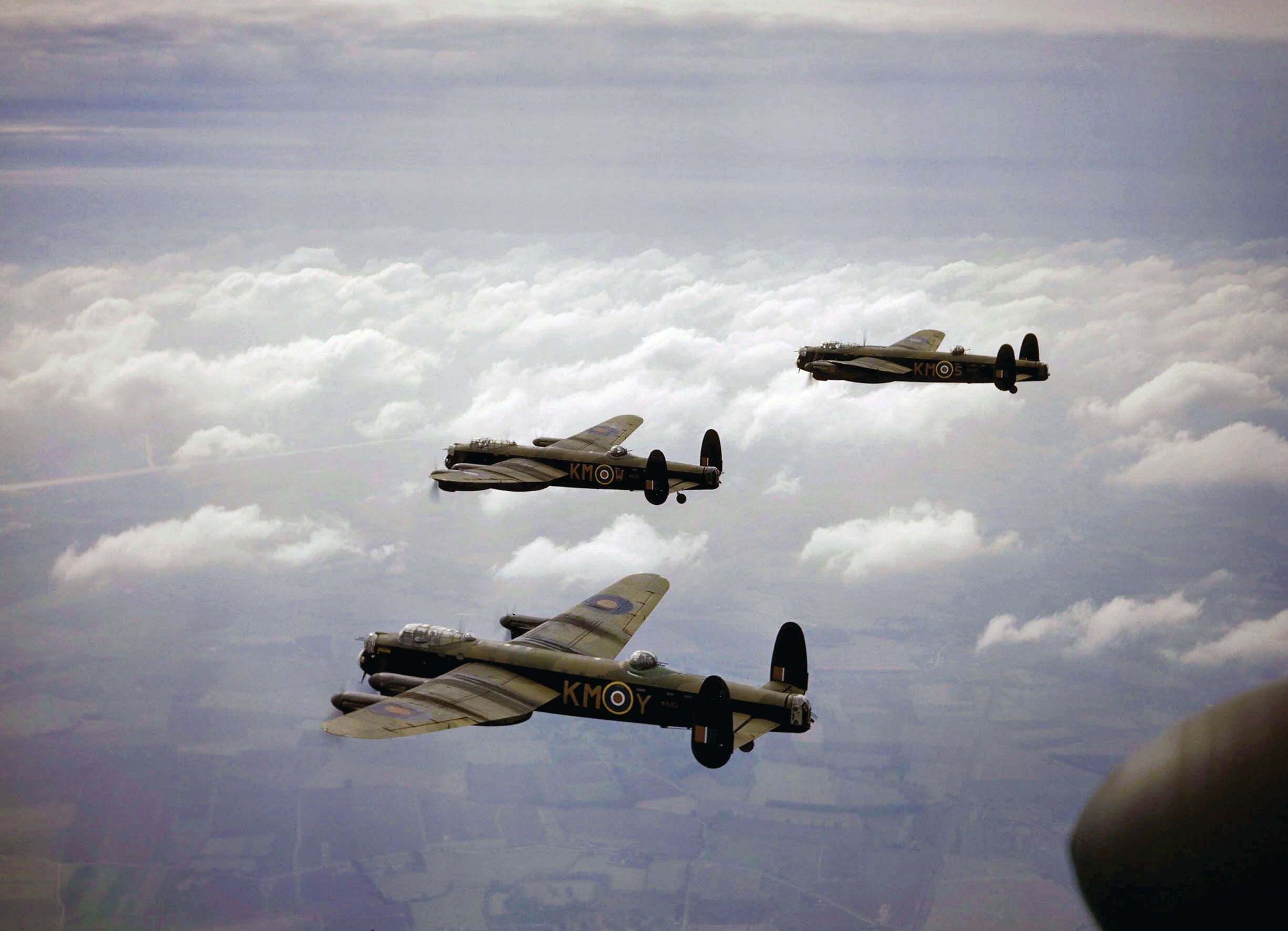A trio of Avro Lancaster heavy bombers of No. 44 Squadron RAF fly toward a city in Germany during a raid in September 1942. To many observers, the Lancaster was the finest Allied bomber of World War II in Europe.