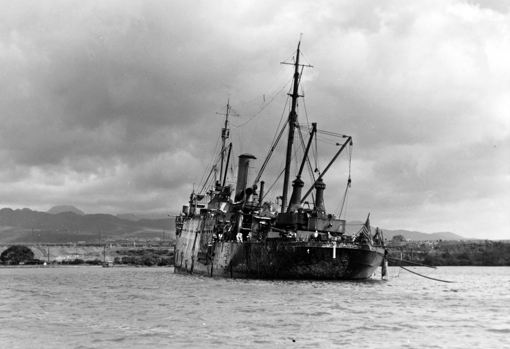 Commander Young ordered the USS Vestal to get underway as flames engulfed Arizona, then grounded his ship to save it. Vestal’s crew aided sailors trapped in the capsized battleship USS Oklahoma.