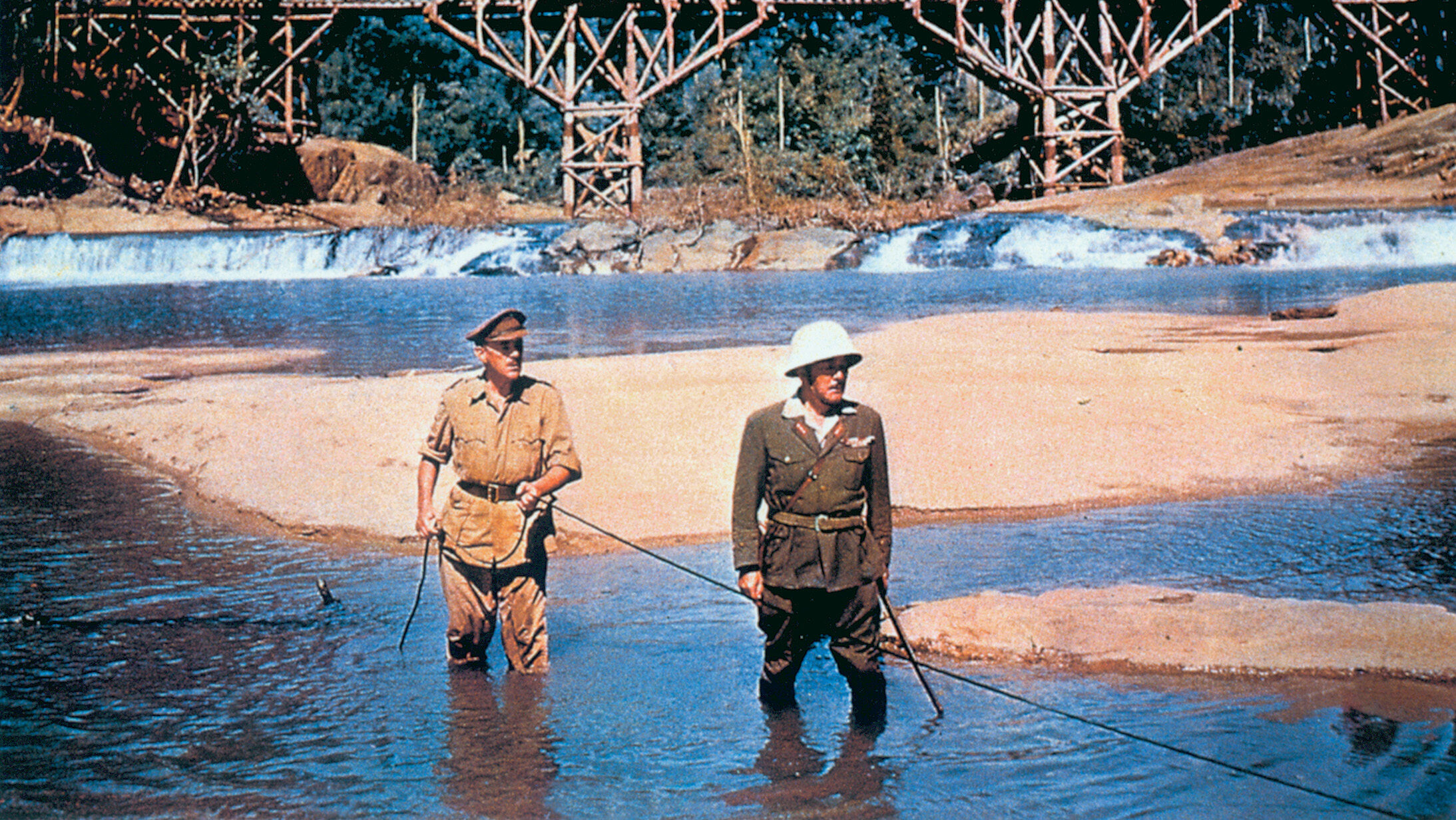 A Japanese POW commander (Sessue Hayakawa) and a British colonel (Alec Guinness) conduct a battle of wills in The Bridge On the River Kwai.