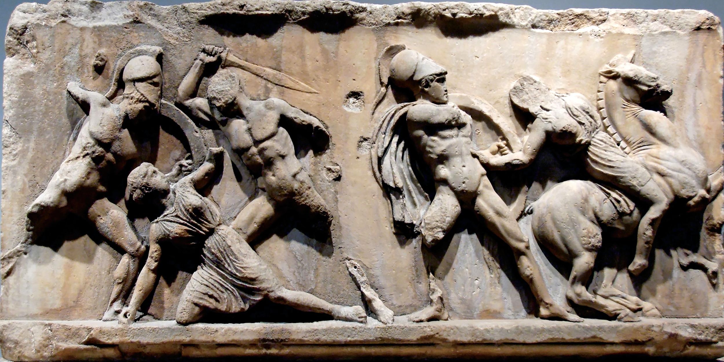 This slab of the Amazonomachy frieze from the Mausoleum at Halikarnassos, now in the British Museum, depicts Greek warriors battling Amazons.