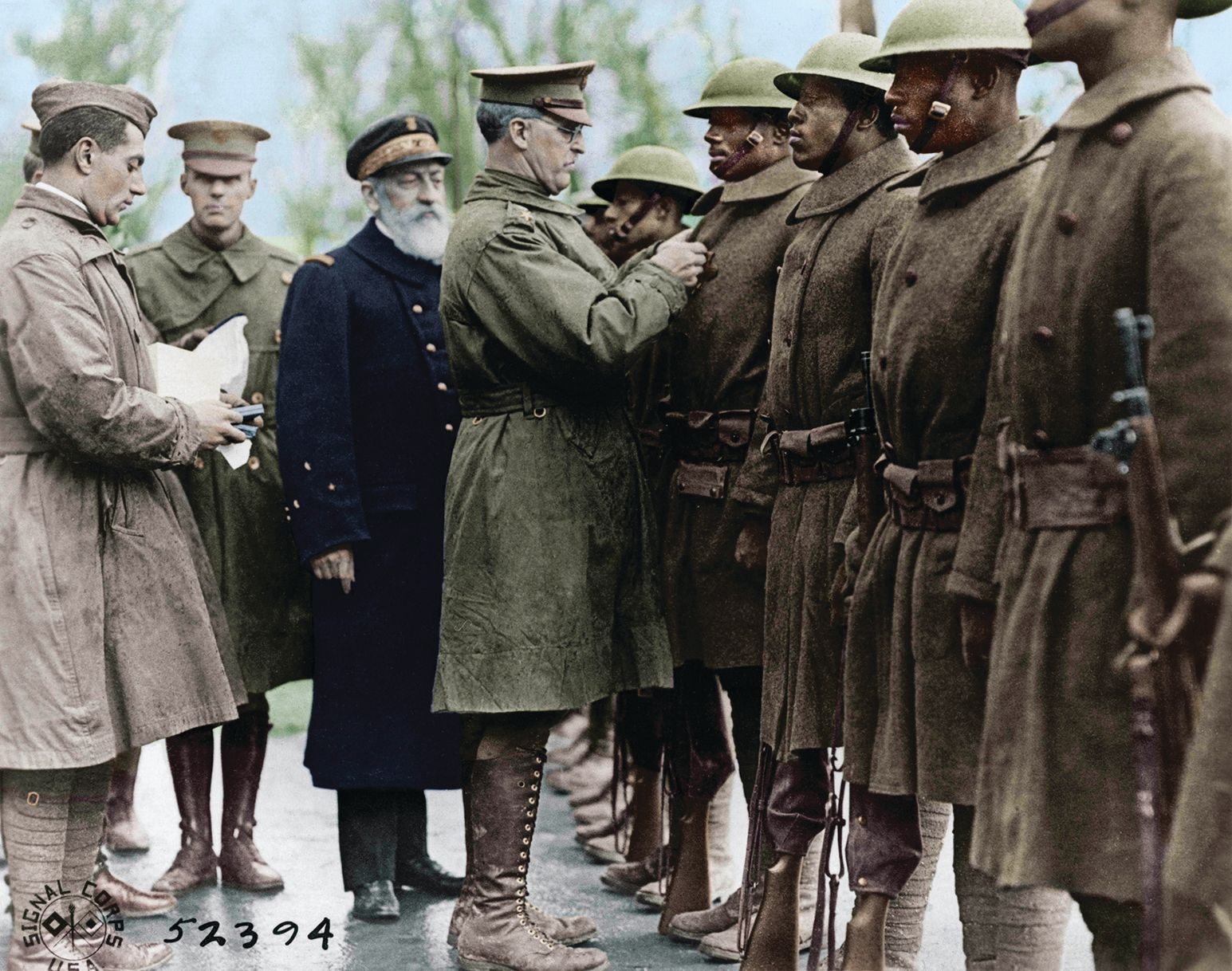 Soldiers of the 369th receive medals awarded by France for their valor in battle fighting along side of the French Army. Henry Johnson and Robert Needham received the French Croix du Guerre.