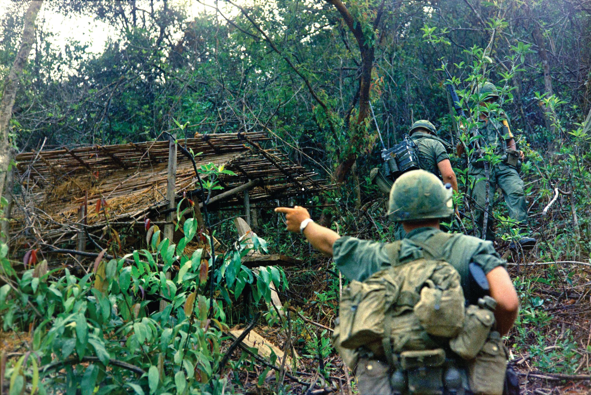 26 October 1967: Soldiers from Company “D,” 2nd Battalion, 35th Infantry, 3rd Brigade, 4th Infantry Division move up a hill to check out a hut during a search and destroy mission in the Quang Ngai Province, 8 kilometers West of Duc Pho, Republic of Vietnam.