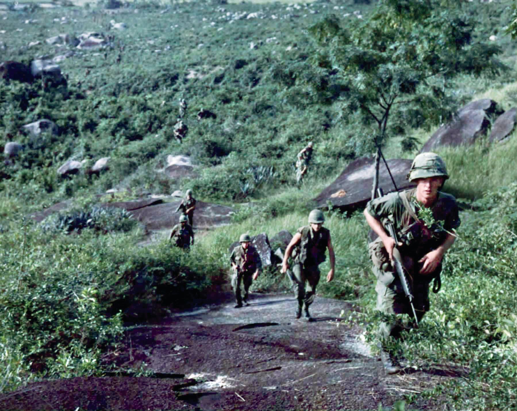 Men of “A” Company, 2nd Battalion, 12th Cavalry climb a slope outside of LZ Ross during Operation Wallowa. 