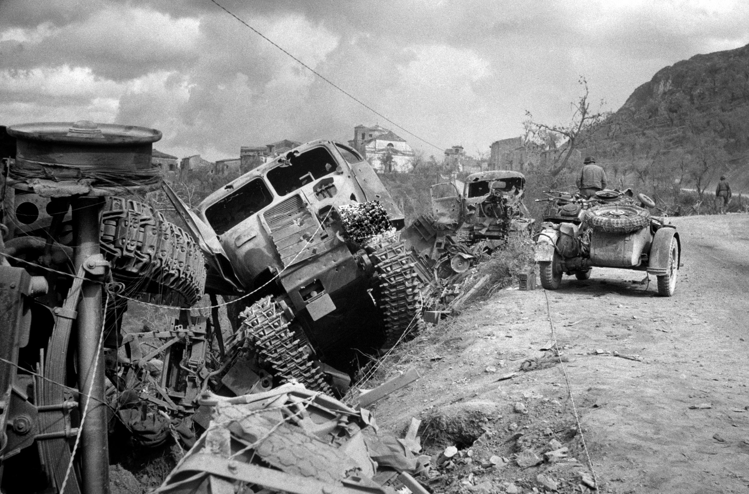 German trucks and armored vehicles destroyed during the assault on the “Hitler Line” lie in heaps of twisted steel after being pushed to the side of the road during the Canadian advance near the town of Pontecorvo.