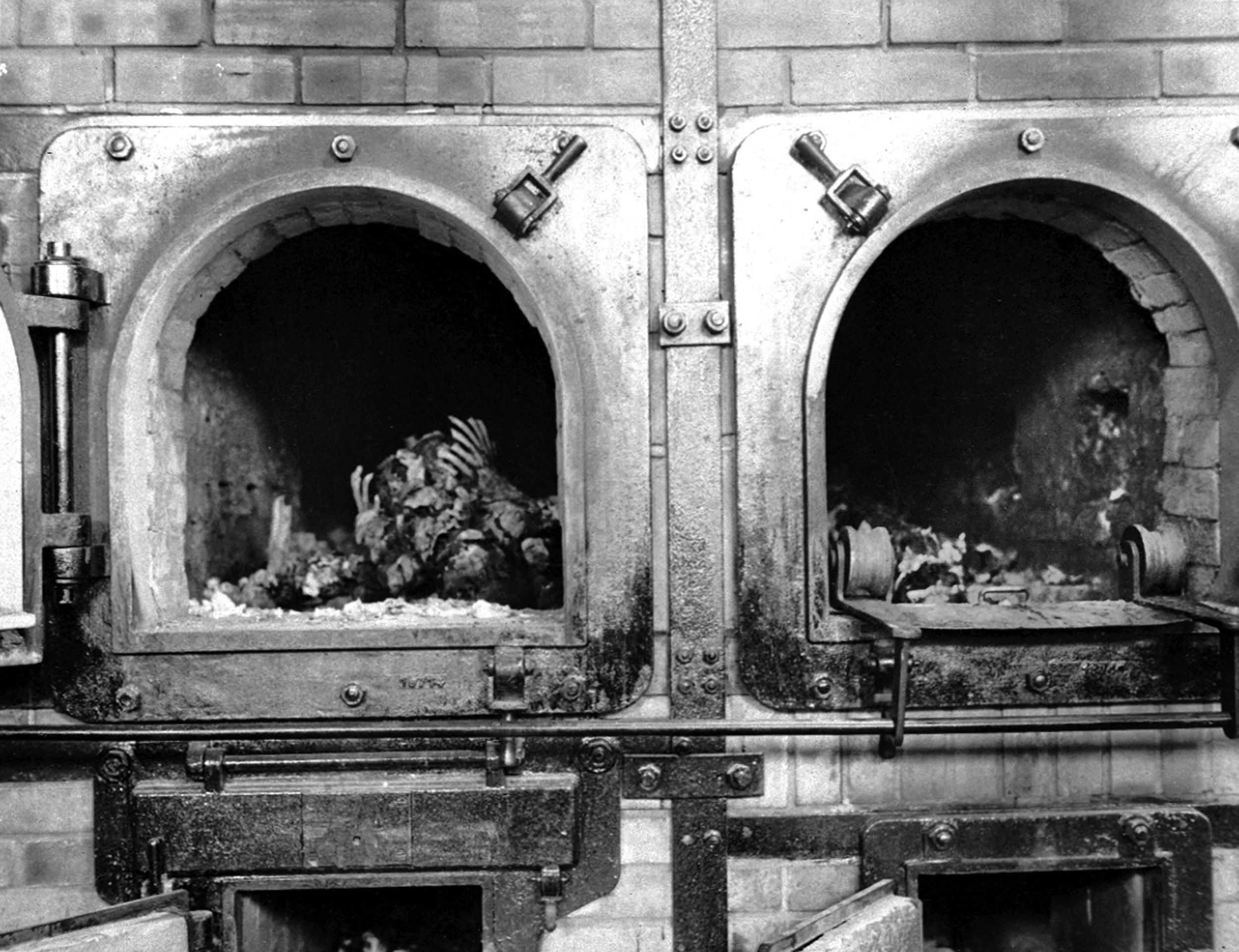 The charred remains of inmates who were executed or died from starvation or disease are shown inside a crematory oven at the Buchenwald concentration camp. The camp was liberated by the U.S. 80th Infantry Division. 