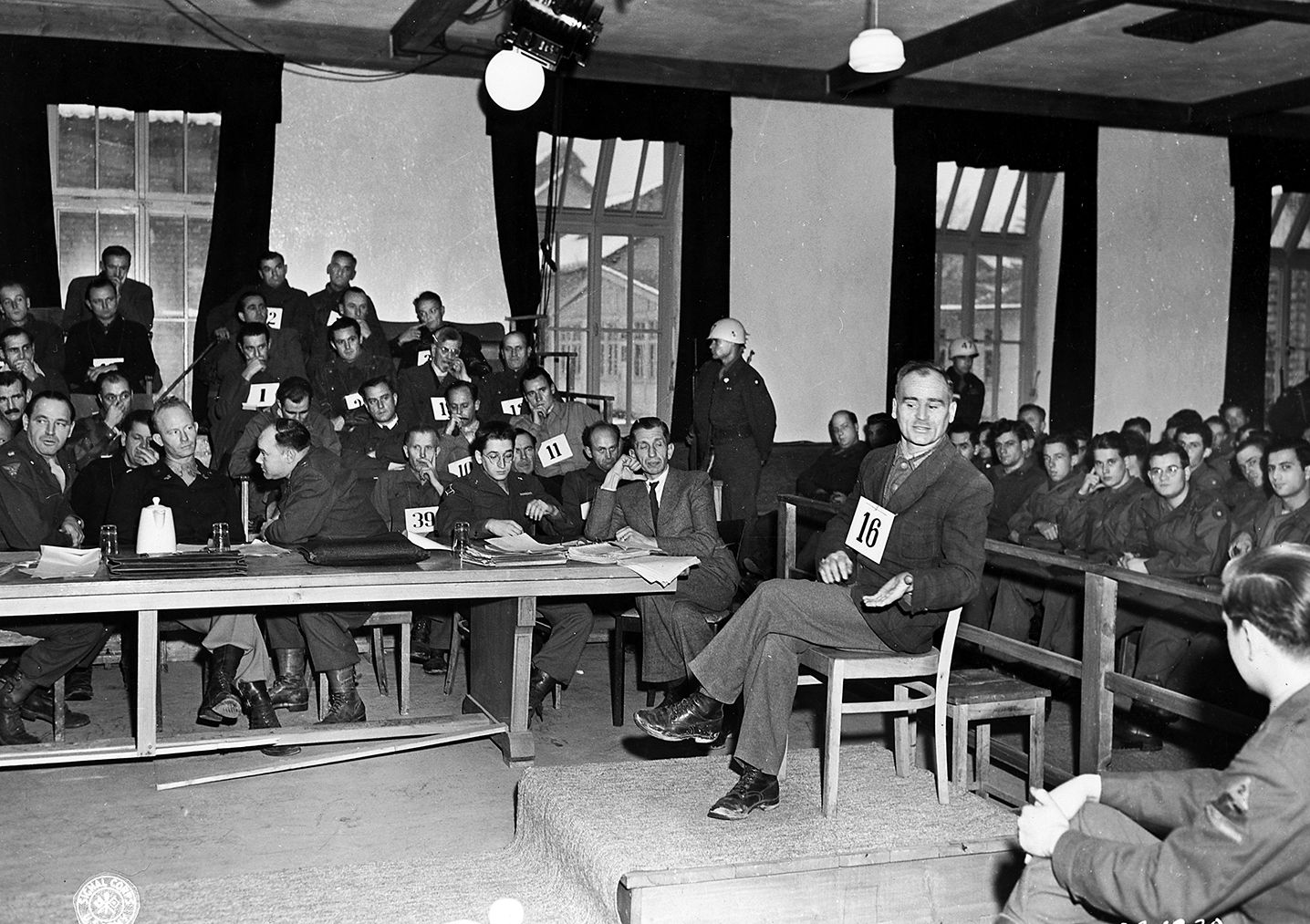 Defendant Christof Ludwig Knoll, a former political prisoner and block leader, testifies at the trial of former camp personnel and prisoners from the Dachau concentration camp on December 7, 1945.