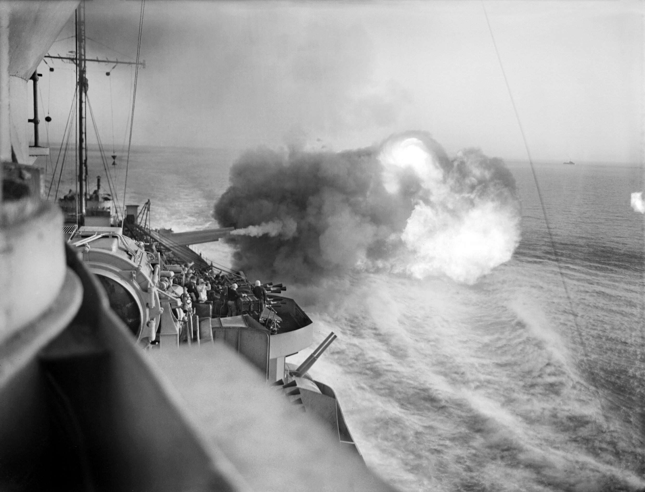 Warspite’s 15-inch guns belch fire as she bombards German shore batteries at Catania, Sicily, in support of the British advance up the island’s east coast in August 1943.