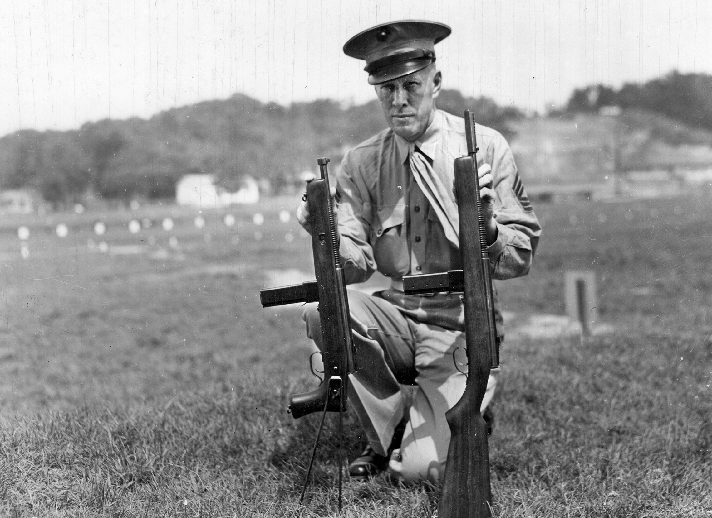 U.S. Marine Master Gunnery Sergeant V.J. Kavits poses with the Model 55 and the standard Model 50 Reising. Neither fulfilled the expectations of the U.S. Marine Corps.