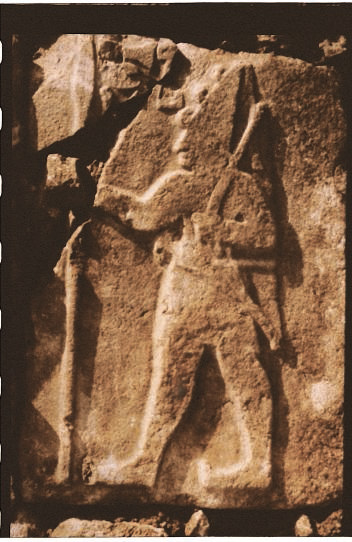 Stone carving of Hittite King Suppiluliuma I outfitted for war with bow and lance.