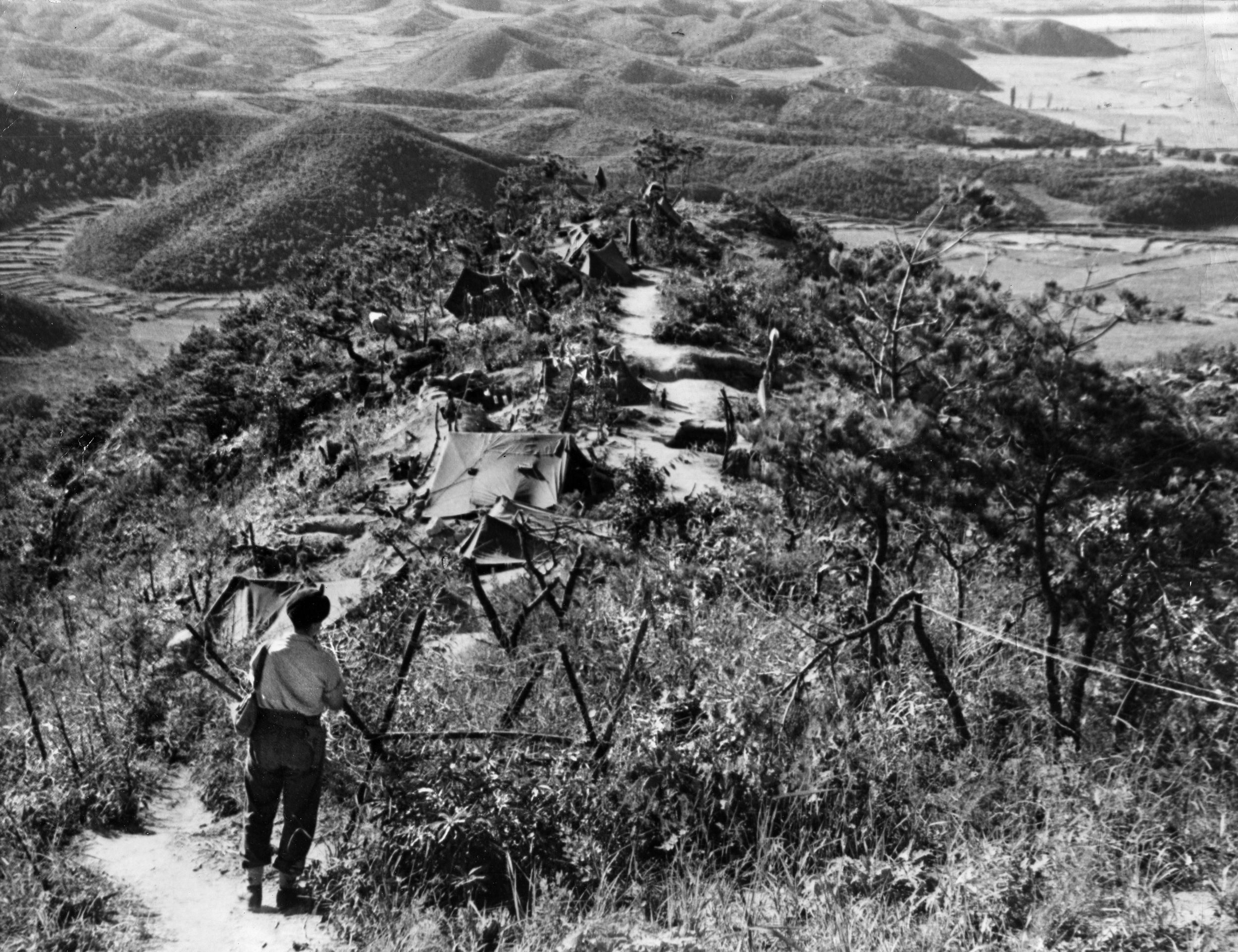 A northwest view from the summit of Hill 235 near the Imjin River. Chinese forces penetrated the UN lines, cutting off what is now known as “Gloster Hill.” The Gloucestershire Regiment was ordered to “Hold on where you are.” On April 25, 1951, a combined relief force of infantry and armor was stopped 2,000 yards short of the hill. More than a third of the Glosters were killed or wounded and hundreds more were captured.