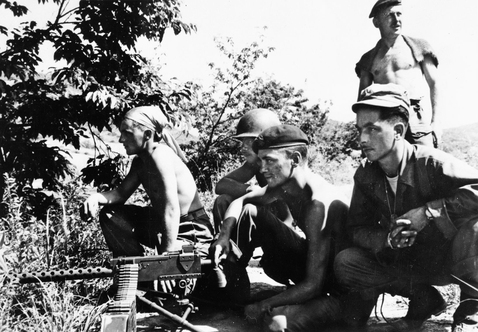 Machine gun crew of Belgian Regiment sets up a position overlooking Chinese forces. Along with the British and other United Nations troops, they were tasked with holding the line at the Imjin River.