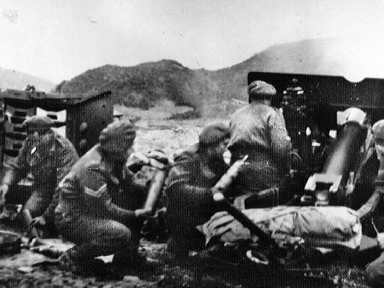 A gun crew fires its 25-pounder in support of UN forces holding the high ground against 10,000 Communist Chinese soldiers attacking over the Imjin River toward Seoul, Korea.