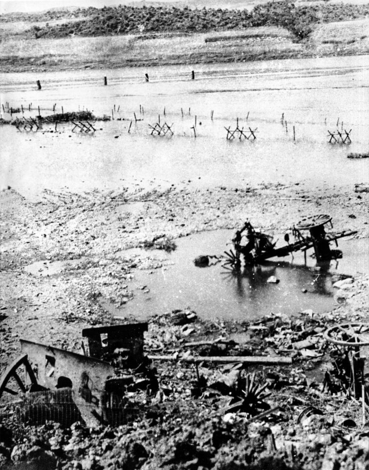 A view of “Gloster Crossing” after the Battle of Imjin, with the wreckage of artillery and supplies left behind by an invasion force of 10,000 Chinese soldiers.