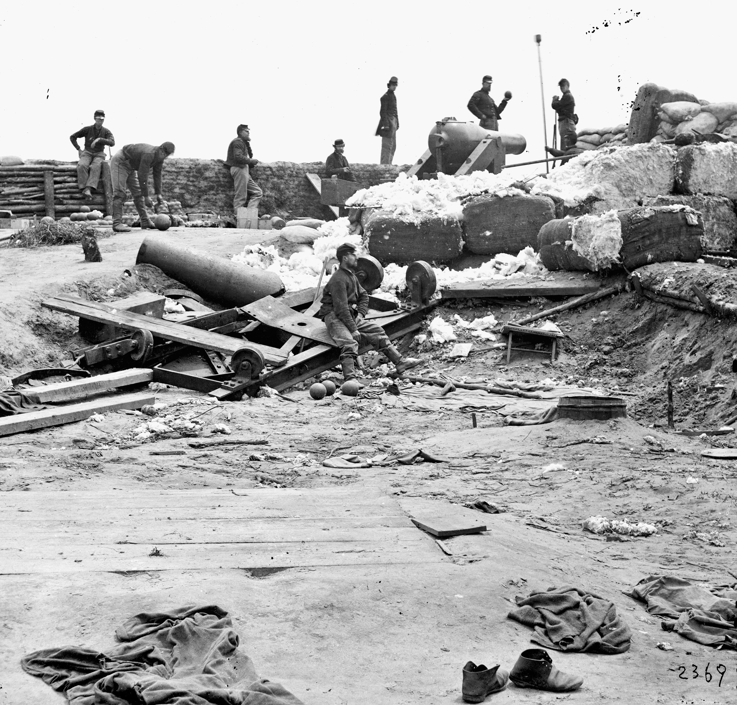 In June 1862, Union troops inspect Confederate guns and fortifications reinforced with bales of cotton abandoned by Gen. Joseph E. Johnston at Yorktown. 