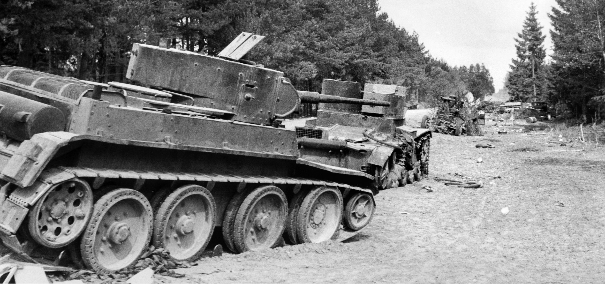 Crippled by German artillery and infantry, Soviet tanks line a Belarusian road after the first battle of the Axis operation “Barbarossa.” Due to maneuvers planned for the next day, Sunday, some 9,000 soldiers from various units were bunked in the fortress when the attack began. Despite the severe losses, Col. Viktor Puganov was able to bring 100 tanks to their staging areas at Zhabinka, about 35 kilometers northeast of Brest Fortress. 