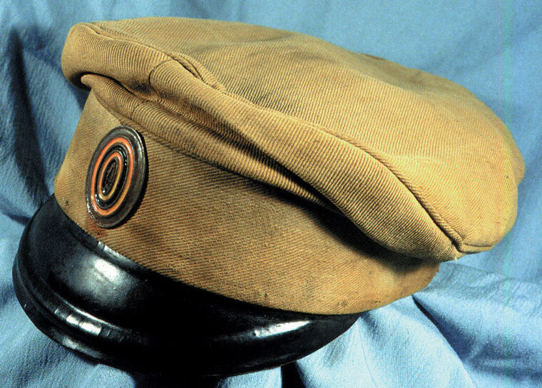 An enlisted rank’s summer field cap with cockade in national colors.