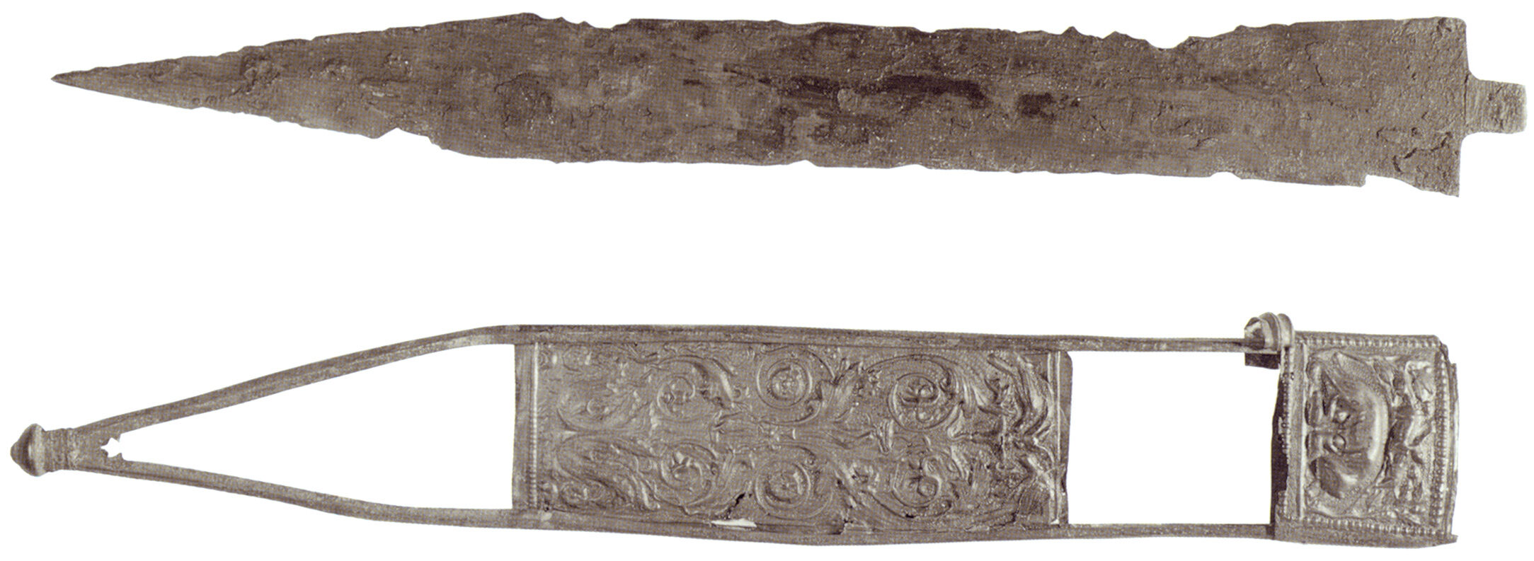 The remnants of a gladius now in the British Museum. Beneath is its scabbard. Portions missing were likely made of wood covered in leather.