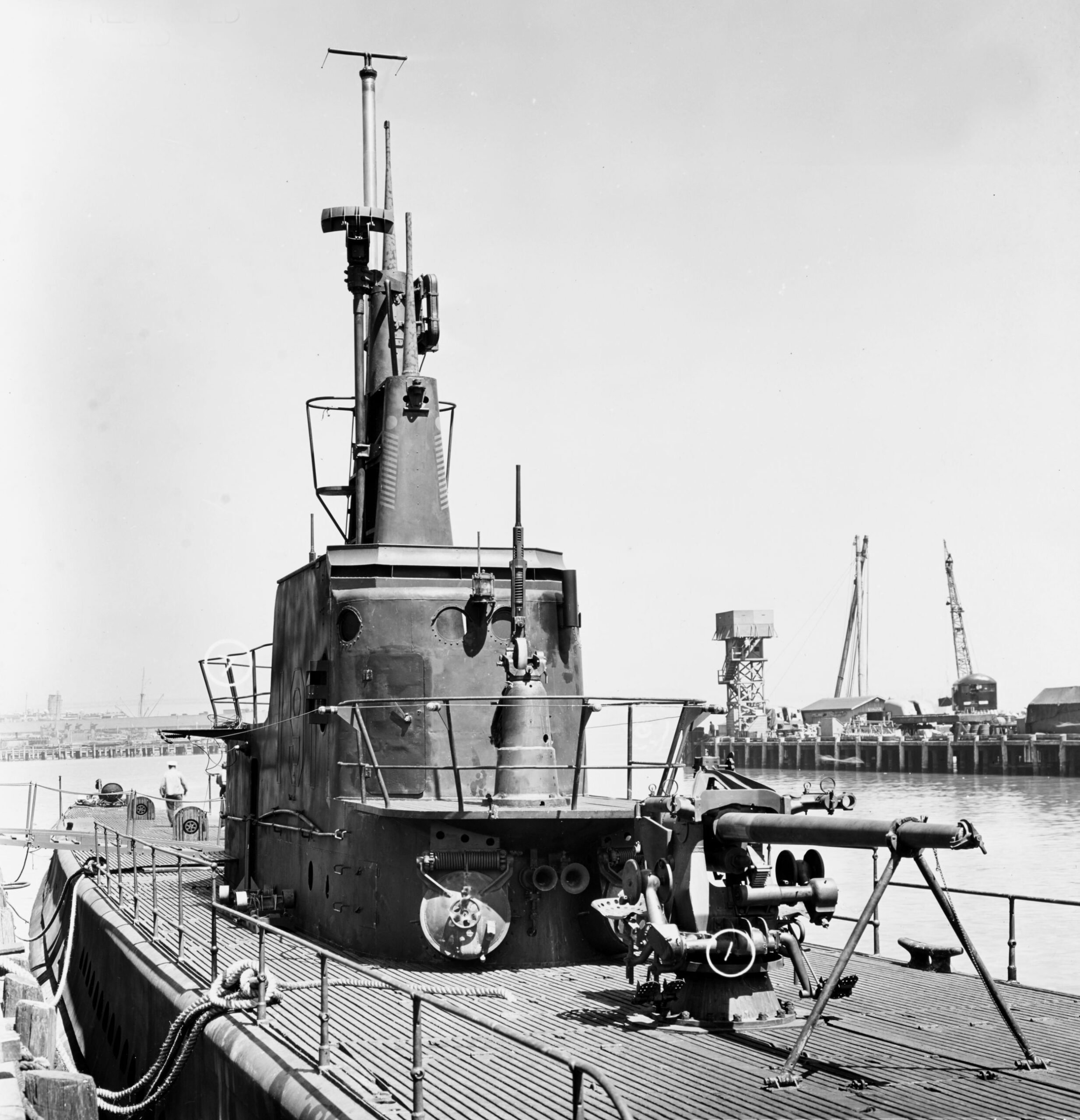 The USS Sculpin docked at the Bethlehem Steel Company shipyard, San Francisco, California, May 1, 1943. The submarine had just completed an overhaul and upgrade in both weaponry and radar systems.