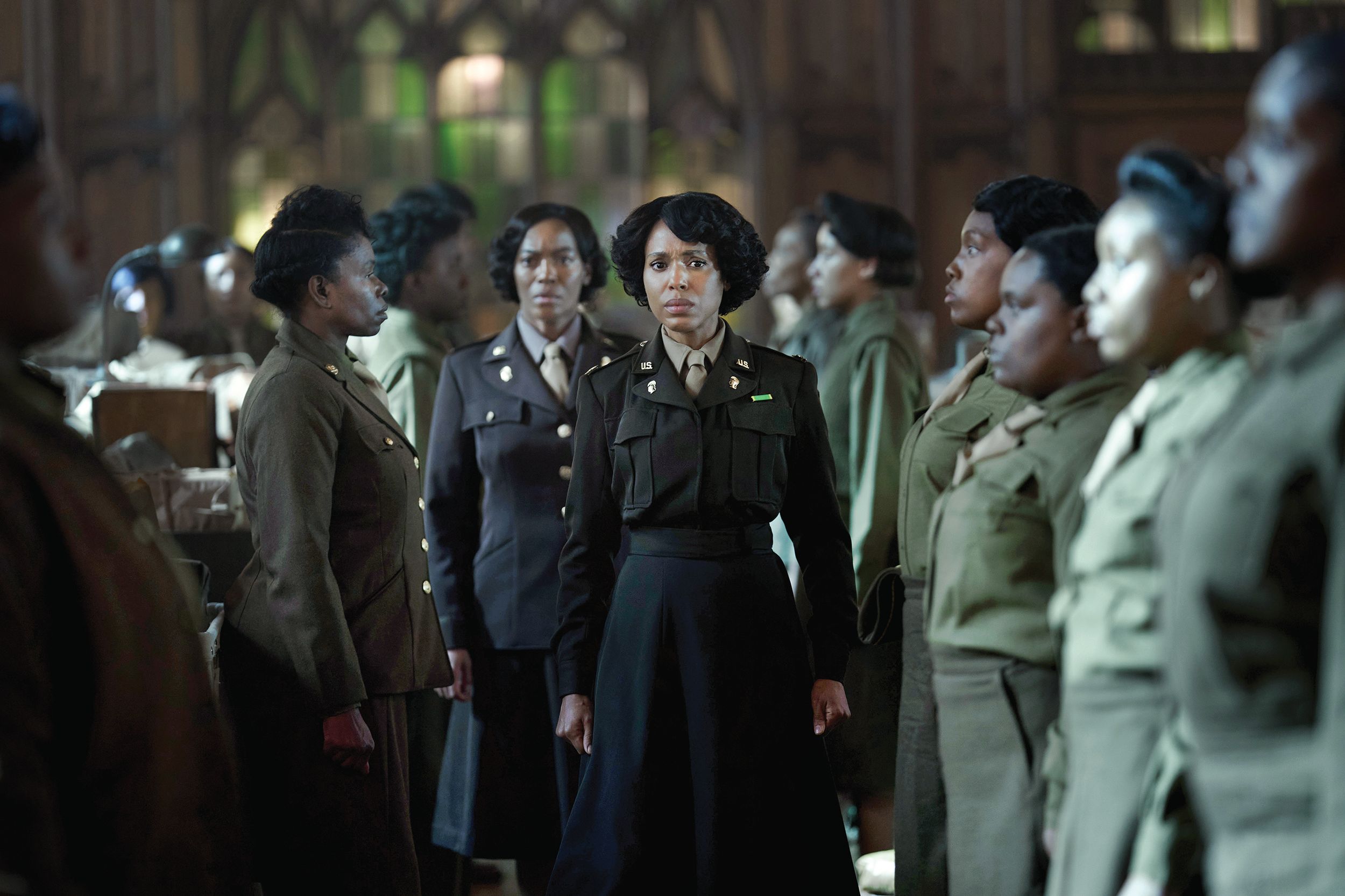 Kerry Washington, as Major Charity Adams, inspects the work of her women soldiers as they try to clear the backlog of U.S. Army mail in Birmingham, England, in the new Netflix film, The Six Triple Eight.