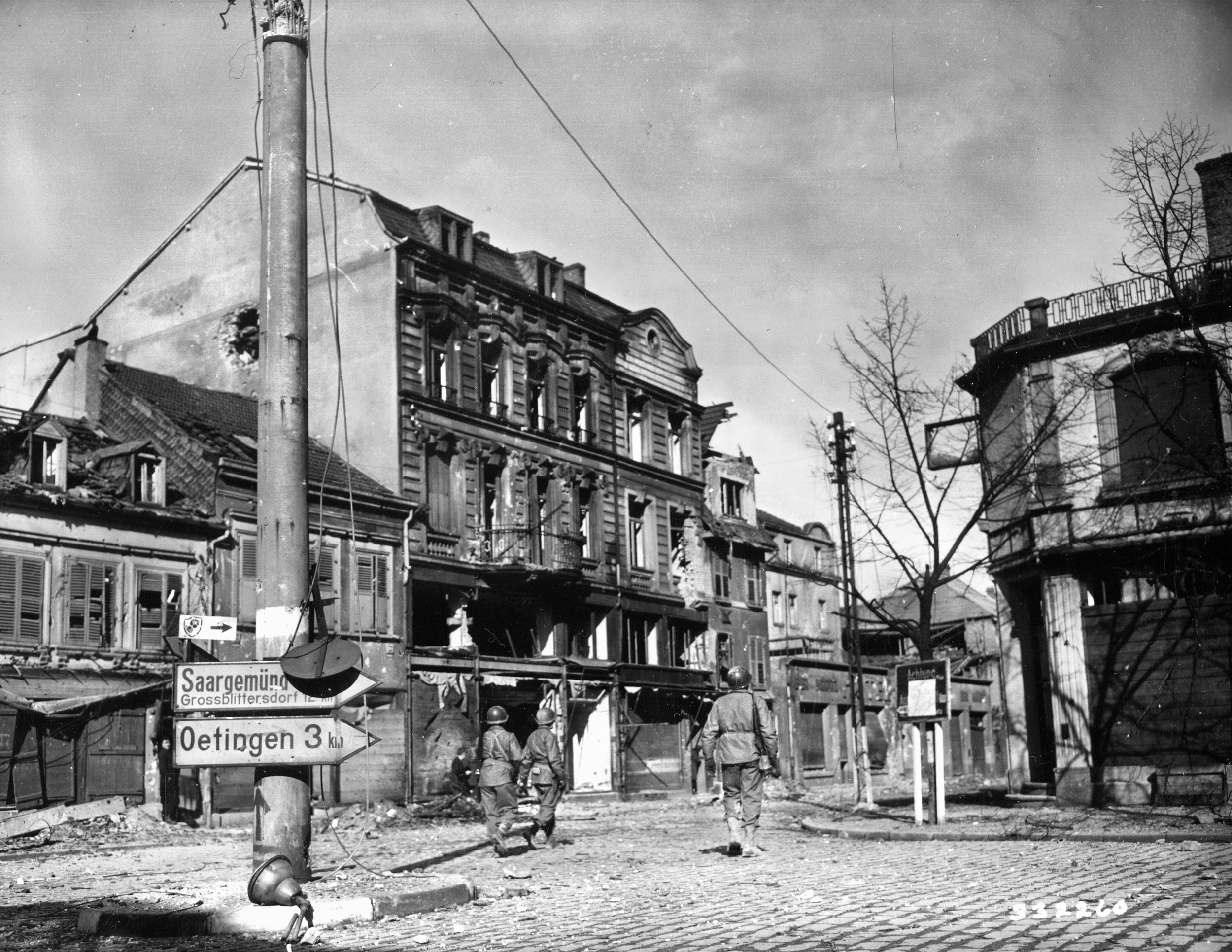 A squad of infantrymen from the 70th Division moves through the French city of Forbach on February 23, 1945. The medical personnel of the division were often near the scene of an ongoing battle and regularly under fire themselves as they went in harm’s way to treat wounded soldiers.