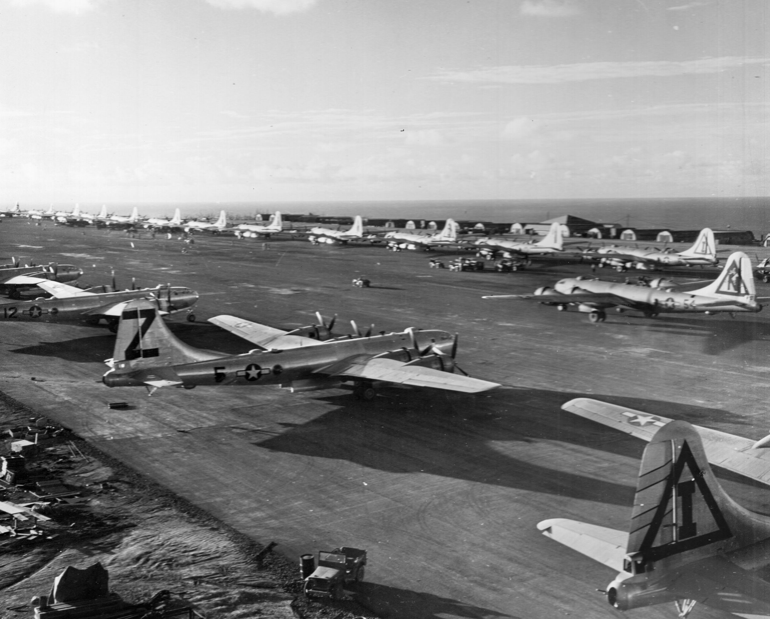 U.S. Army Air Forces Boeing B-29 Superfortress heavy bombers are shown on one of Iwo Jima’s three airfields. American bombers damaged during raids on the Japanese home islands frequently landed at Iwo Jima, even as the fighting continued to rout out stubborn Japanese defenders in the island’s extensive system of caves and tunnels.