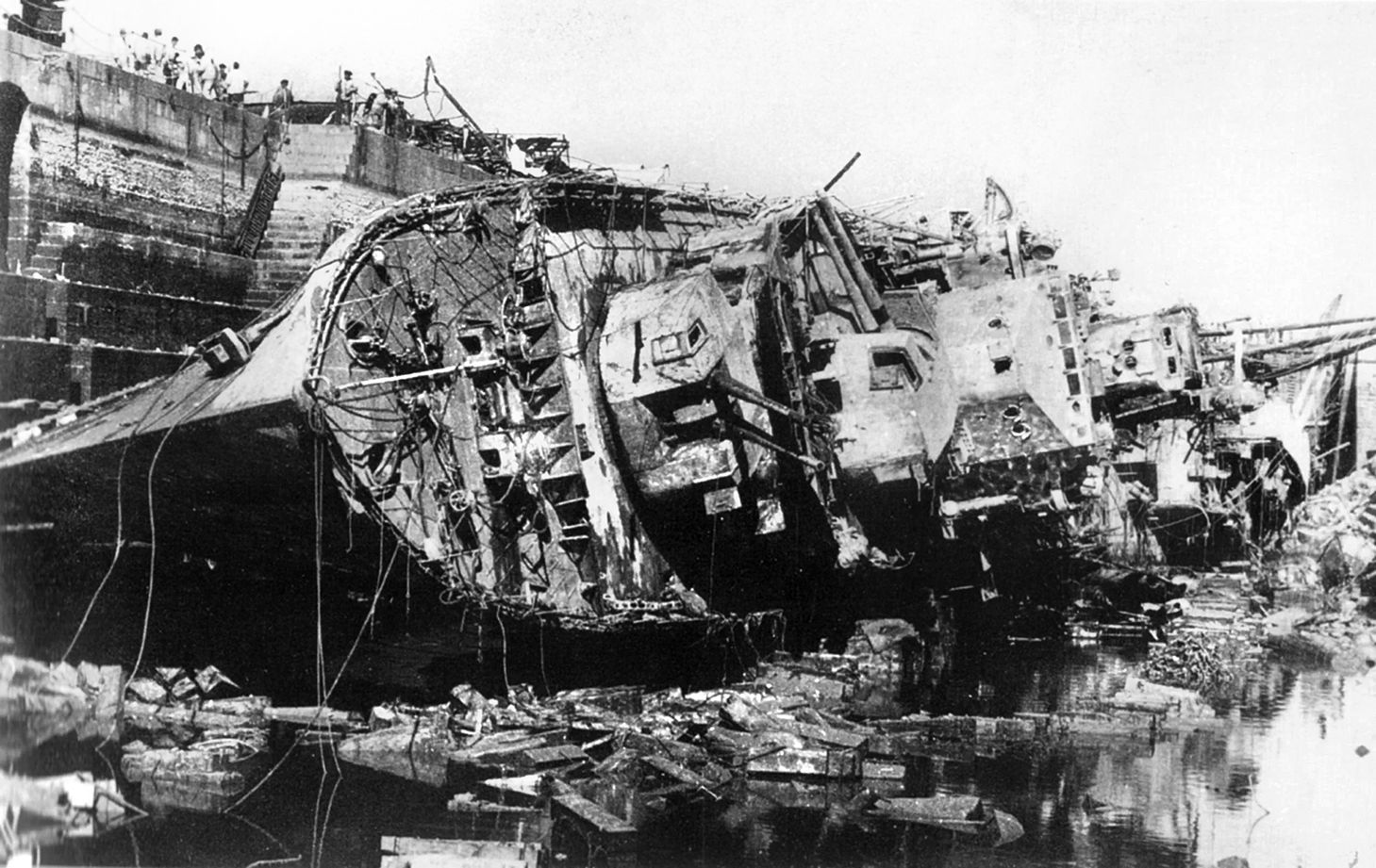 The destroyer HMS Kingston was declared a constructive total loss after being heavily damaged by Axis aircraft. The warship lies on its side in dry dock at Malta on April 11, 1942.