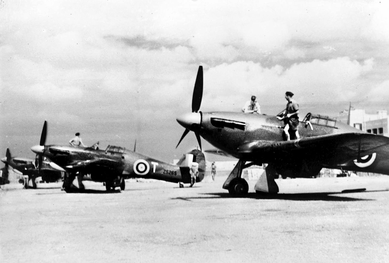 Hawker Hurricane Mk II fighters of No. 185 Squadron RAF are lined up at Hal Far on the island of Malta. Although the Allies reinforced the air defenses of Malta several times, combat losses reduced their strength significantly during the battle for supremacy in the Mediterranean.