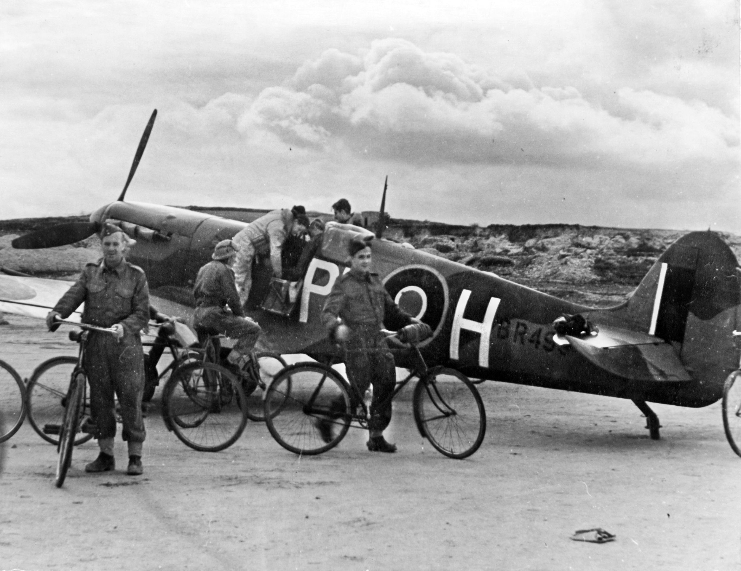 British ground crewmen prepare to take a midday break as they service aircraft for the defense of Malta on January 20, 1943. Several men are seen finishing their task to keep a Supermarine Spitfire fighter serviceable. Fuel was a precious commodity on Malta, and these men used bicycles quite frequently to move from airfields to other facilities.