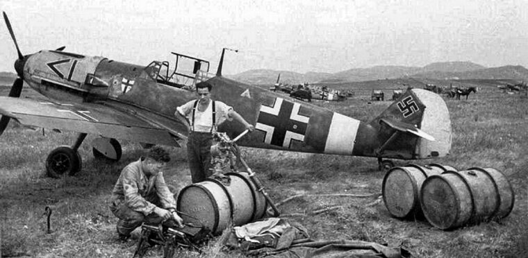 Many of the Axis air sorties flown against Malta originated from airfields on the island of Sicily. In this photo, crewmen service a Messerschmitt Me-109 fighter belonging to Jagdgeschwader 27 (JG 27), a Luftwaffe fighter wing based in Sicily.