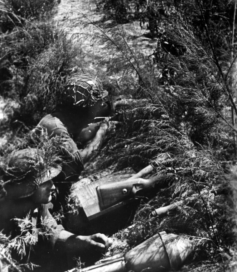 German panzergrenadiers, heavily armed with rifles, grenades, and anti-tank weapons, man positions in a trench along the Gothic Line near the Adriatic coast and await the inevitable attacks of the British Eighth Army in the summer of 1944. 