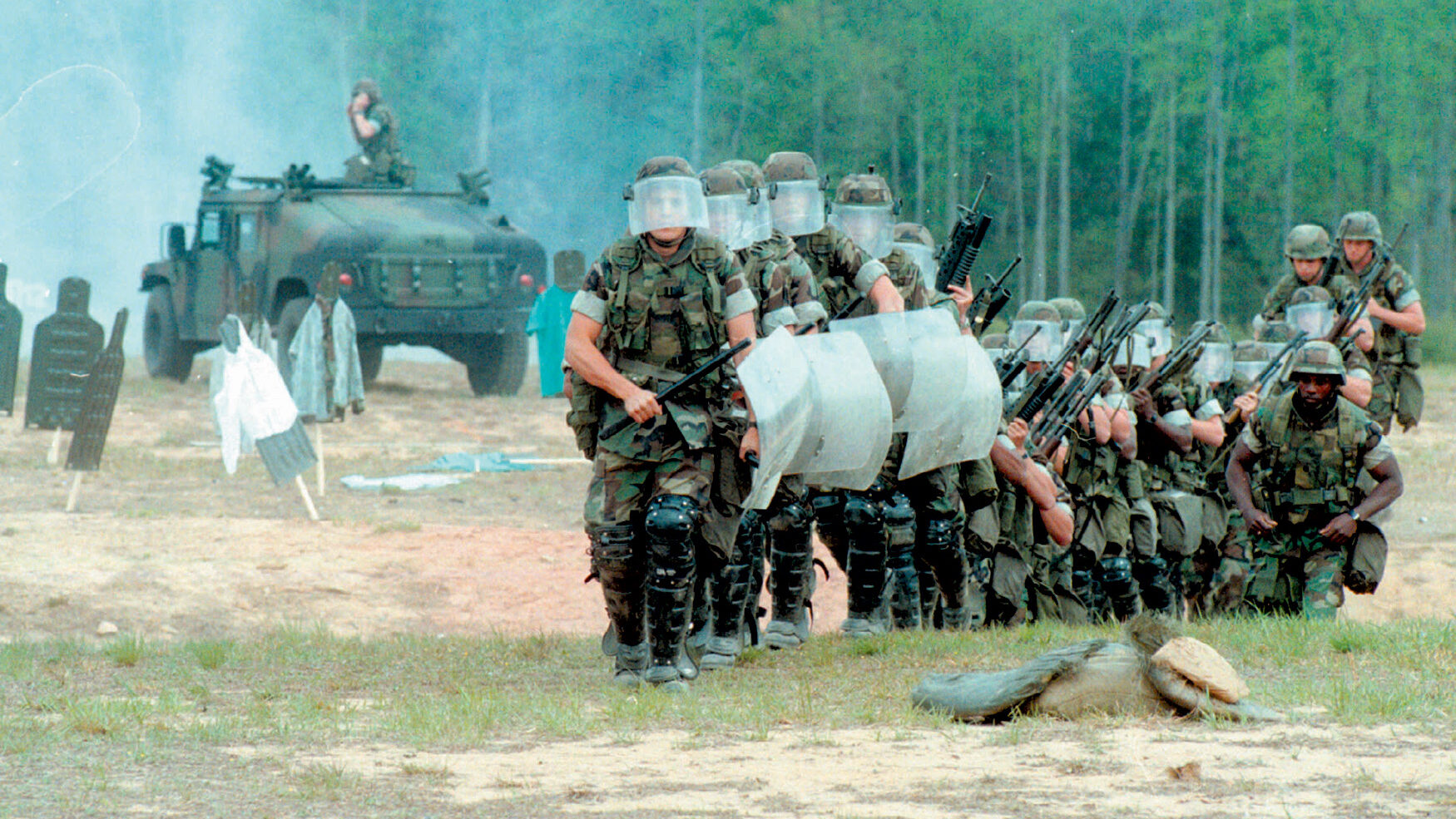 U. S. Marines train for a crowd control mission. Despite their own use of non-lethal weapons, they require protection themselves against thrown objects.