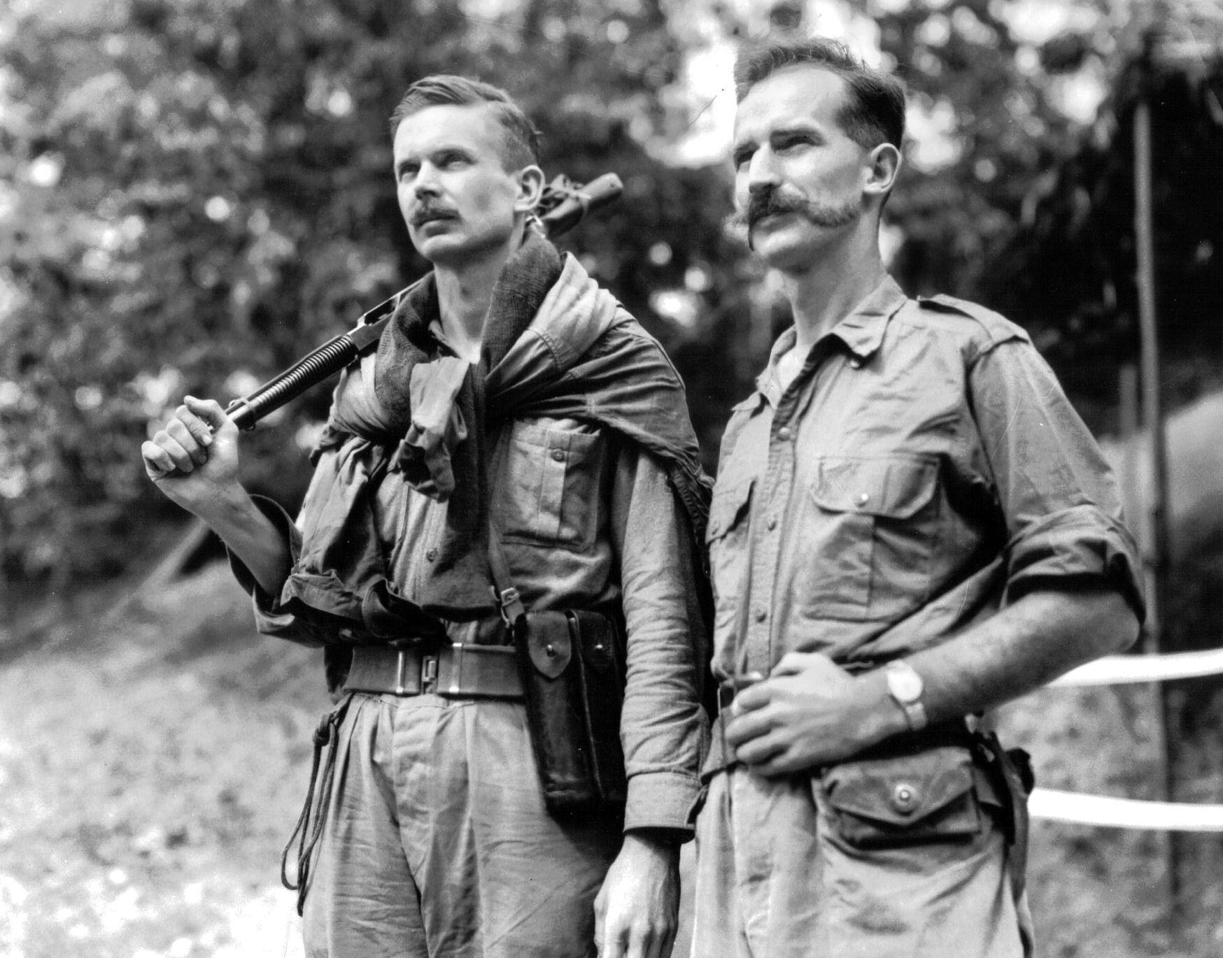 On the night of September 24, 1952, Lieutenant H. “Russ” Gardner, left, and Corp. Karl E. Fowler penetrated the Chinese lines into a kitchen area behind Hill 227 intending to snatch a Chinese soldier. They cut a signal wire and subdued Pvt. Wang Teh Shen when he came to fix the break. Under fire and pursued by the enemy, they managed to escape with their prisoner. 