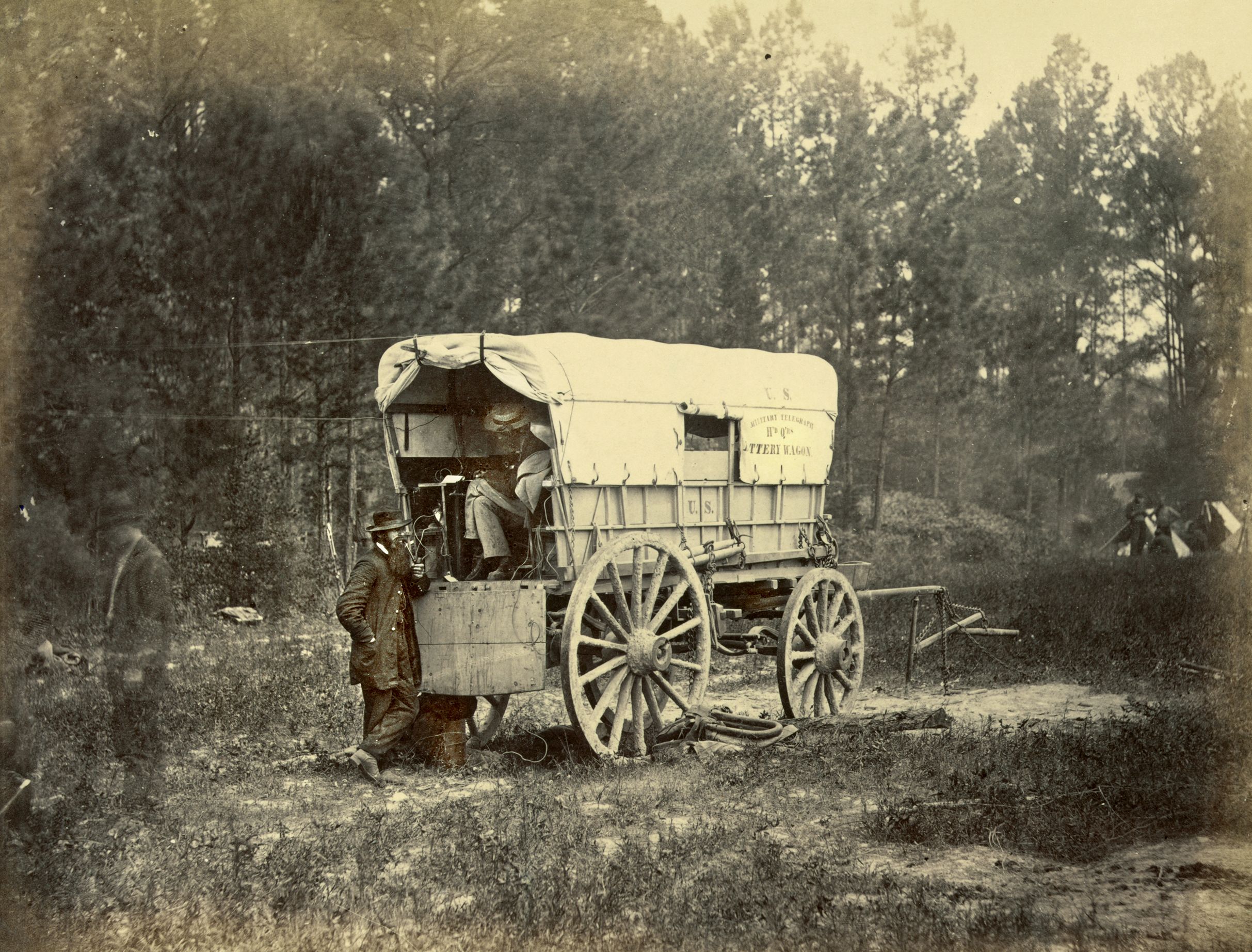 A Union telegraph field wagon carrying the battery used to power the system sits outside of Petersburg, Virginia—one small piece of a communications string stretching for miles along the works of the Federal army.