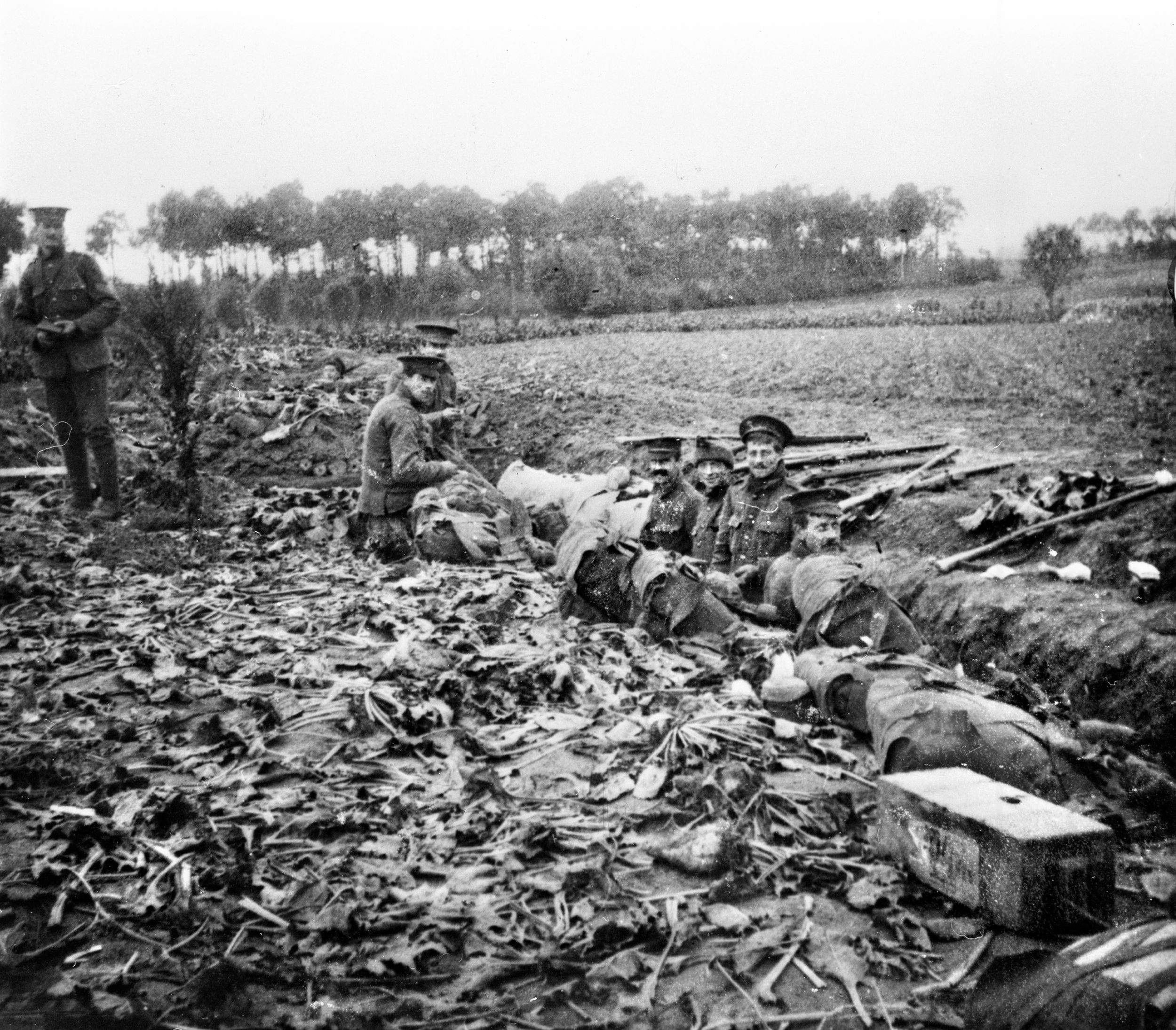 Soldiers of the 2nd Battalion, Scots Guards, man a hastily constructed trench near Zandvoorde, Belgium, south of Ypres, in October 1914. The conflict would soon be stalemated as both sides dug deeper and more elaborate trench systems.