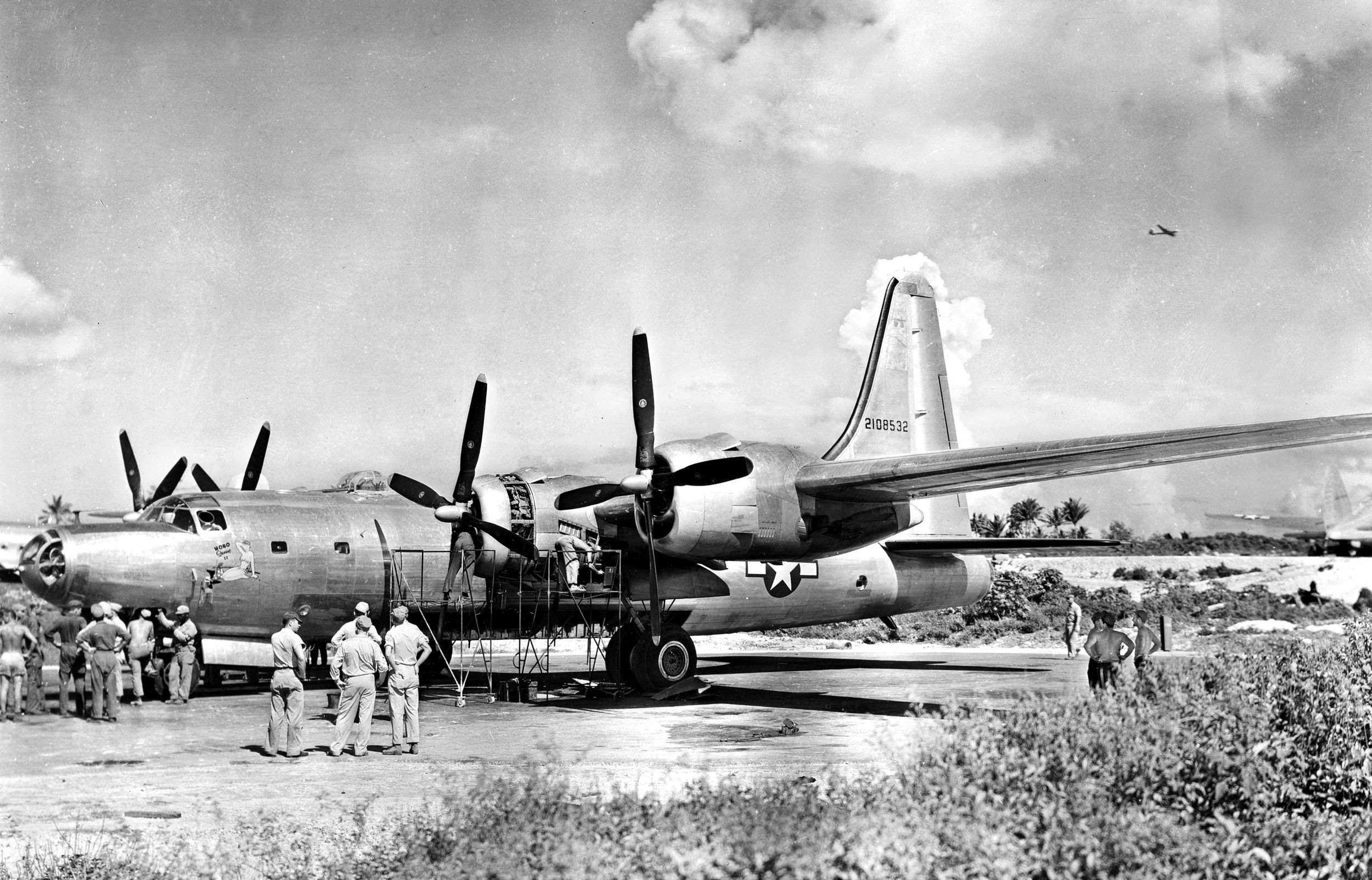 The B-32 Dominator bomber “Hobo Queen II” undergoes maintenance on the island of Tinian in the Marianas in 1945. In development during World War II, relatively few B-32s took part in the action.