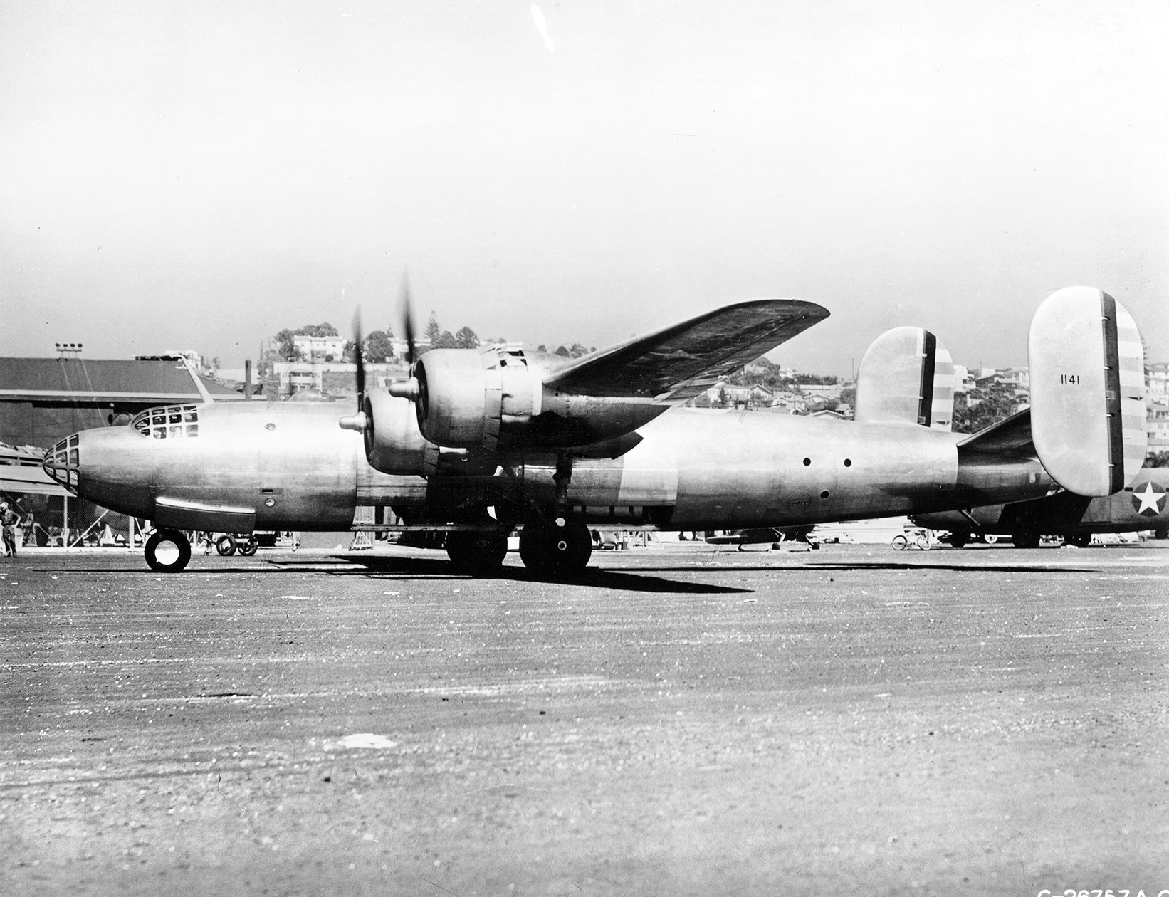 Sporting a twin tail assembly similar to that of the famous B-24 Liberator bomber, a Consolidated XB-32 Dominator prototype is shown with engines running in preparation for a flight in February 1944.