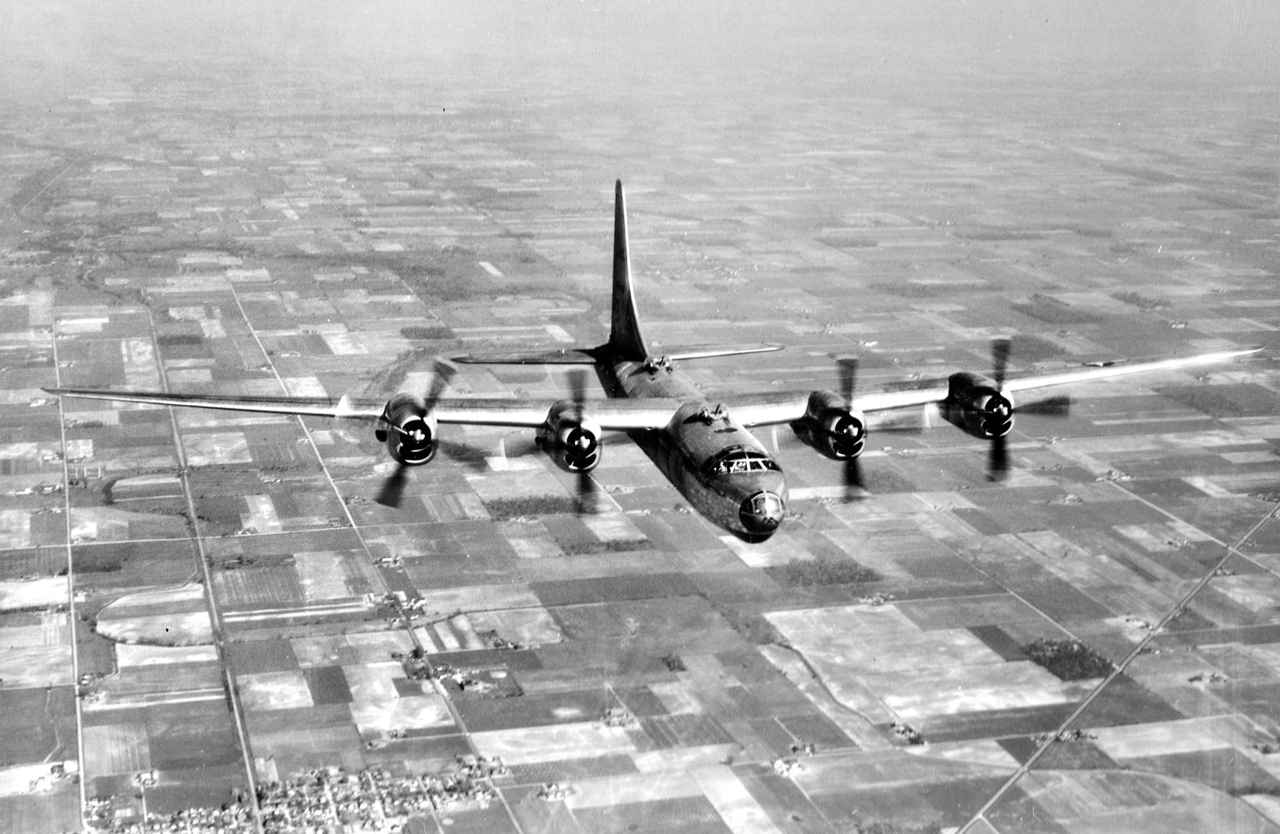 A Consolidated B-32 Dominator bomber with a later tail design flies near Wright Field, Dayton, Ohio, on April 18, 1945. The first production B-32 rolled off the Consolidated assembly line in September 1944, but its nose landing gear promptly collapsed.