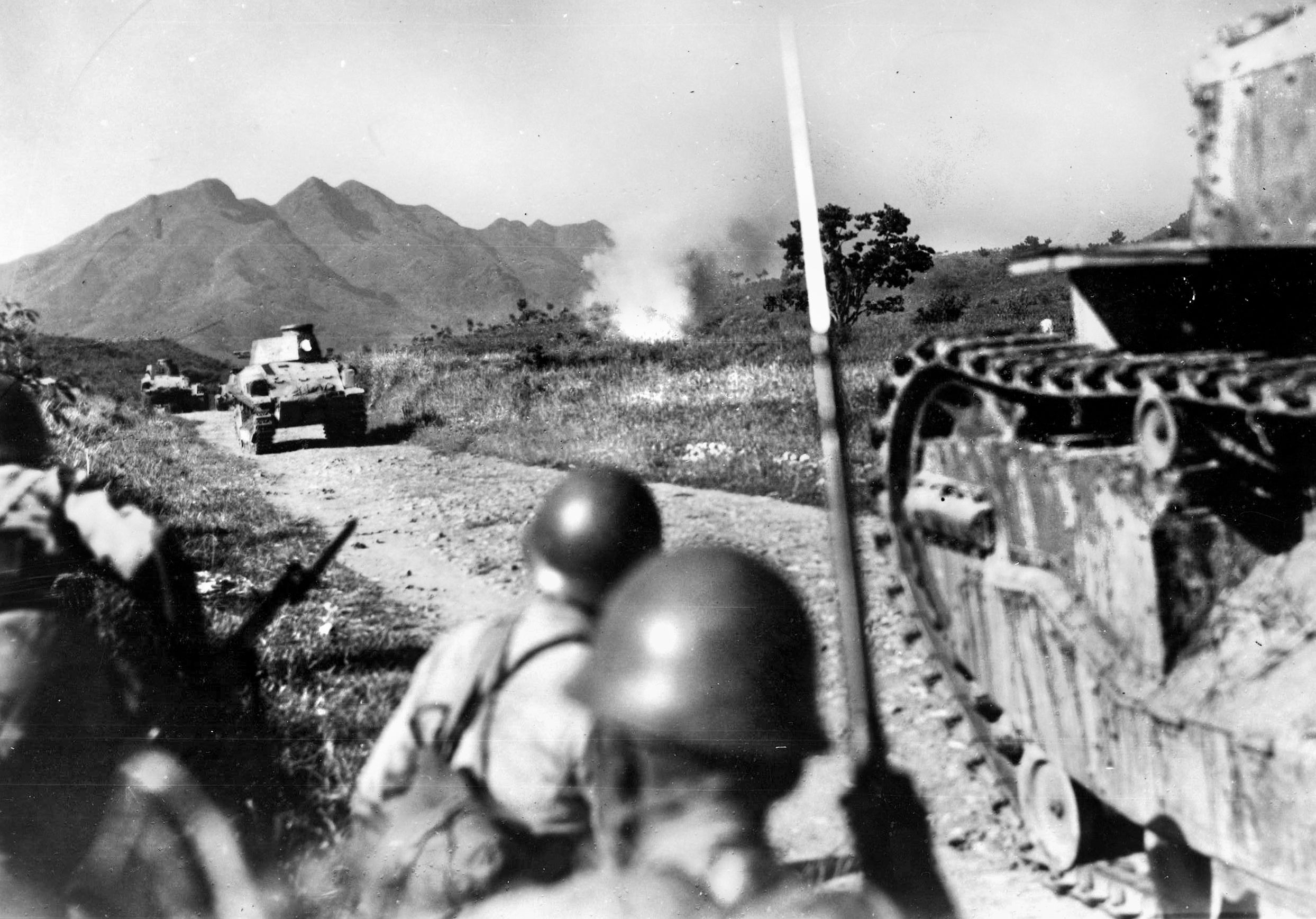 Crossing the Central Mountain Belt in China’s interior, elements of a Japanese tank corps roll forward accompanied by well equipped infantrymen. The Japanese Army did not typically employ armored units in large numbers.