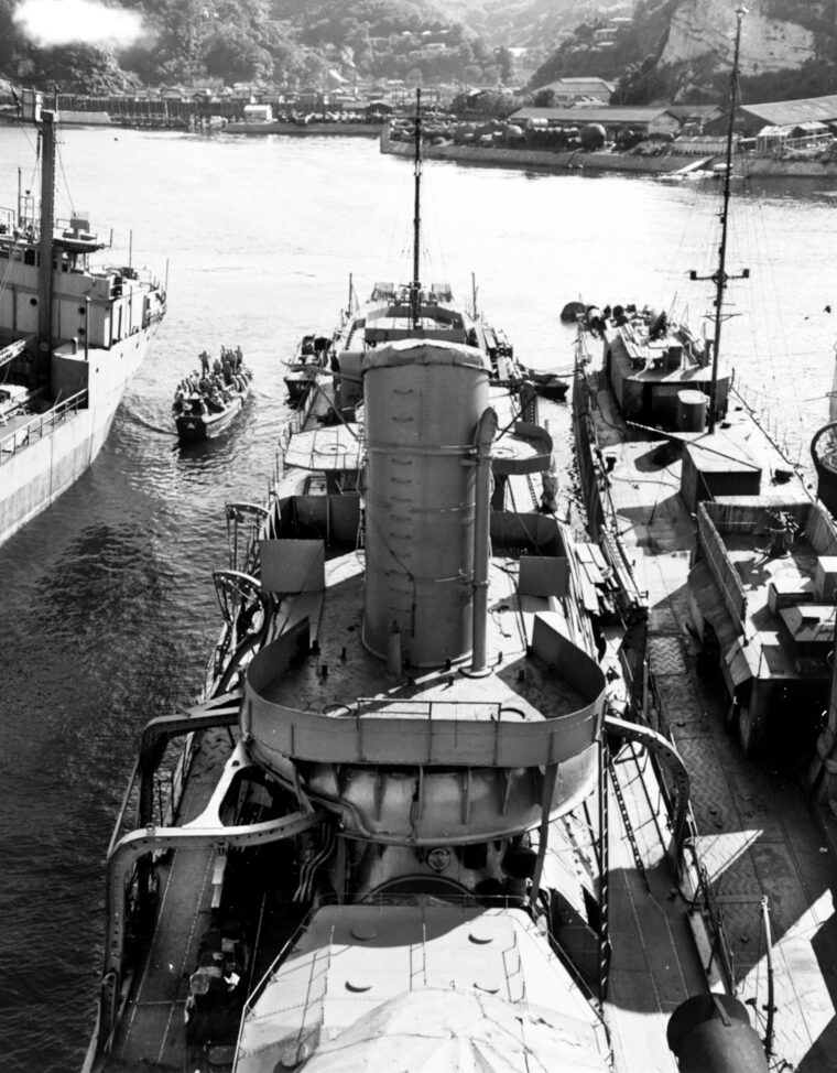 The Japanese destroyer Ushio, one of two Imperial Navy warships that bombarded Midway Atoll on December 7, 1941, is shown at center, while a smaller destroyer of another class appears at right. This photo was taken in September 1945, just as World War II in the Pacific came to an end.