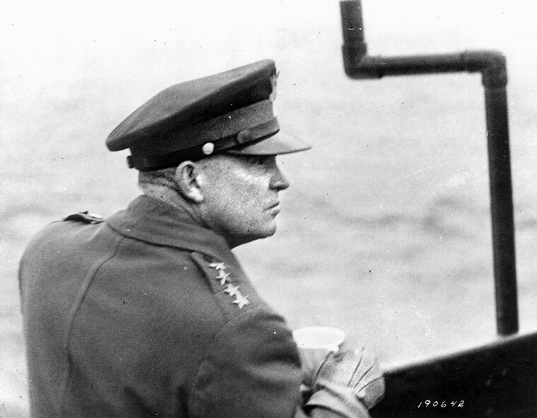 From the deck of a warship in the English Channel, General Eisenhower scans the horizon along the coastline of France June 7, 1944. Eisenhower managed to maintain a sometimes tenuous partnership between the British and American Allies.
