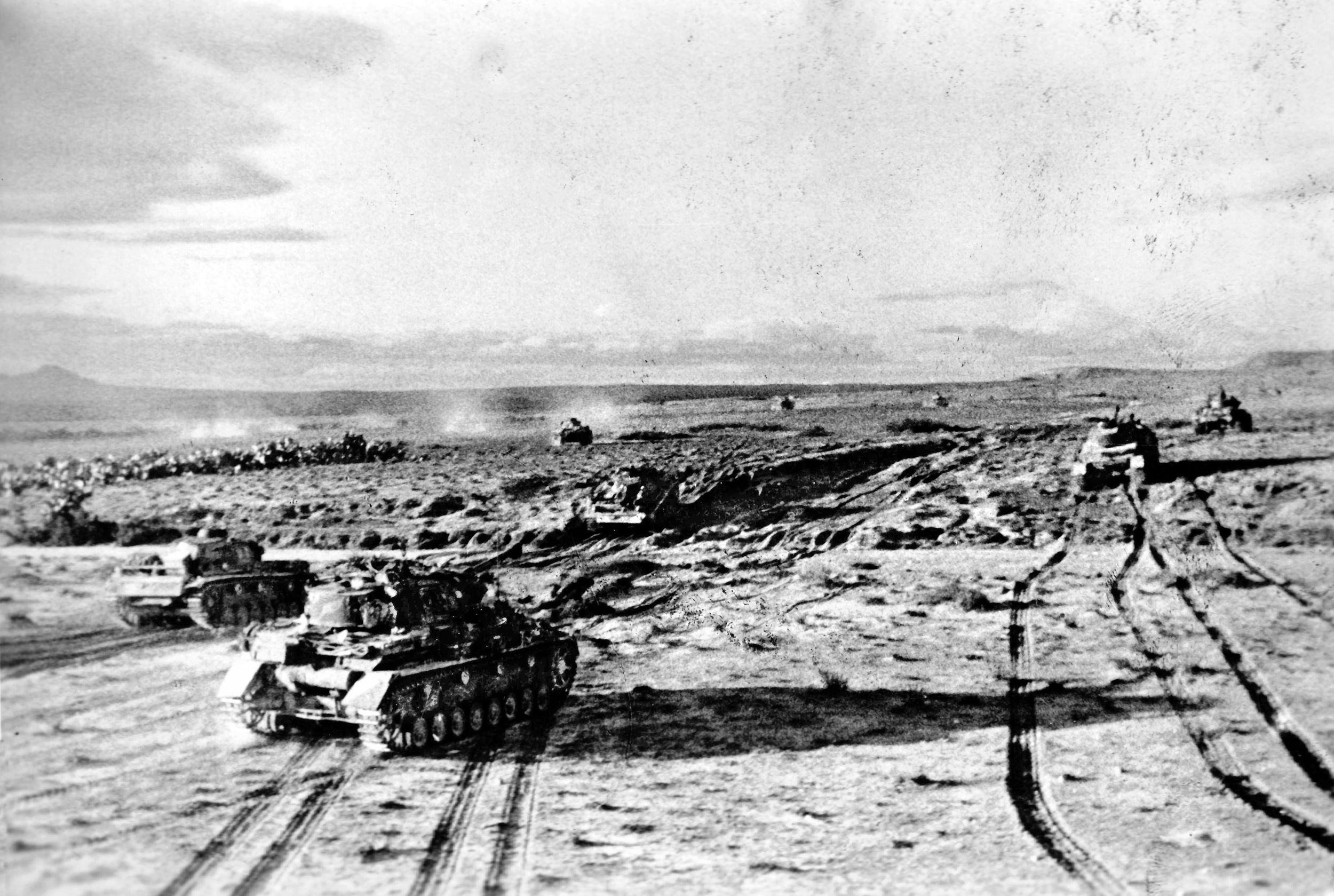 German tanks make their way across the desert of Tunisia as they advance toward U.S. defensive positions near the Kasserine Pass. German Gen. Erwin Rommel, fighting Allied armies on two fronts in early 1943, sensed an opportunity—sending armored spearheads against the unprepared Americans.